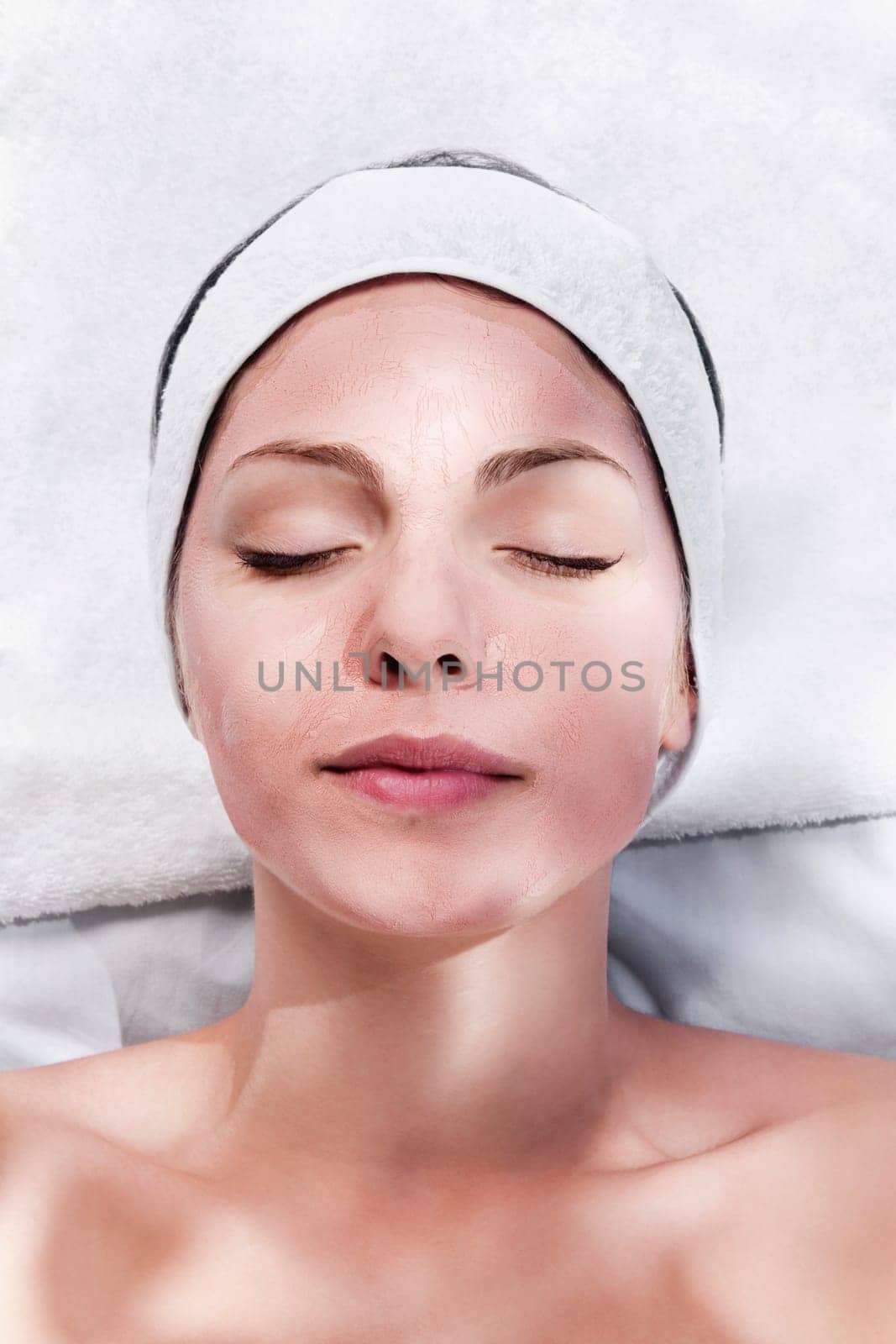 Woman with face pack on her face