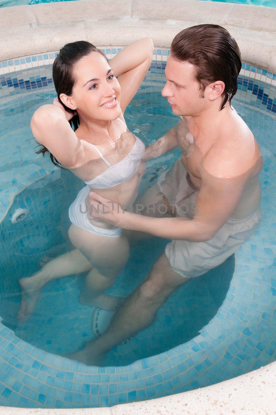 Couple romancing in a hot tub
