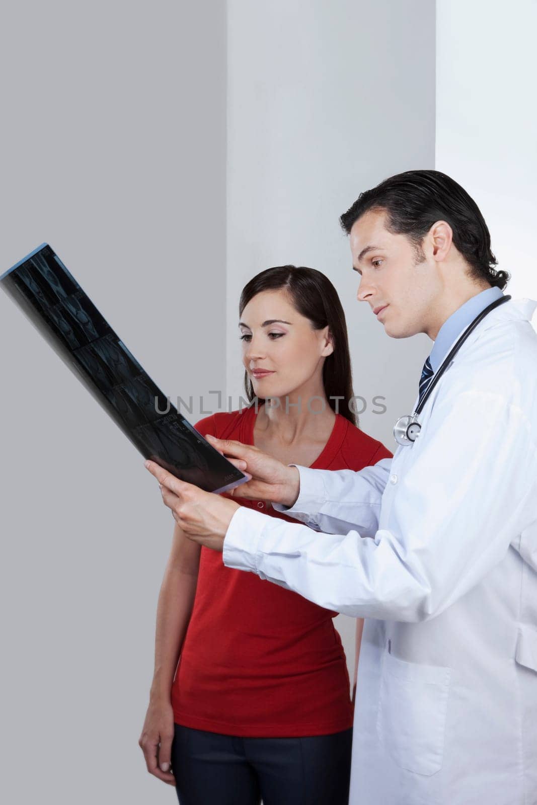 Doctor explaining x_ray report to a patient