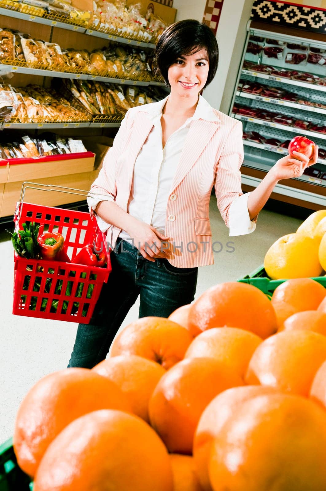 Woman buying fruits in a supermarket