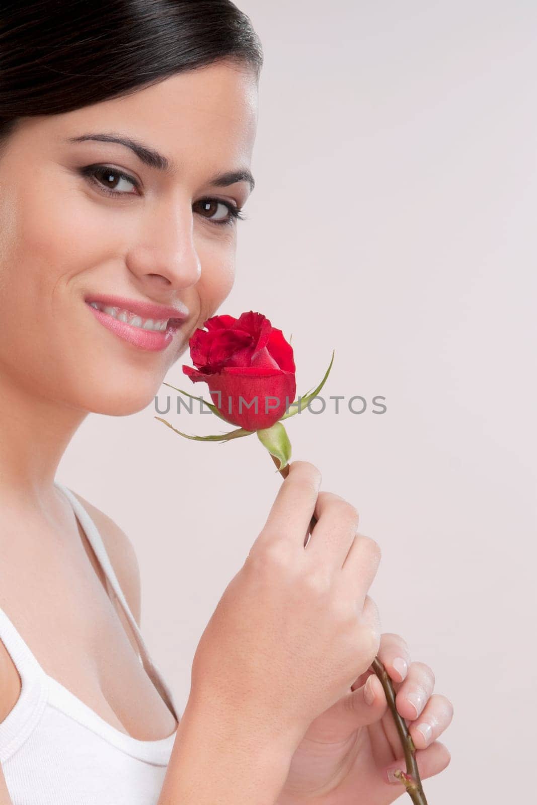 Portrait of a woman holding a rose