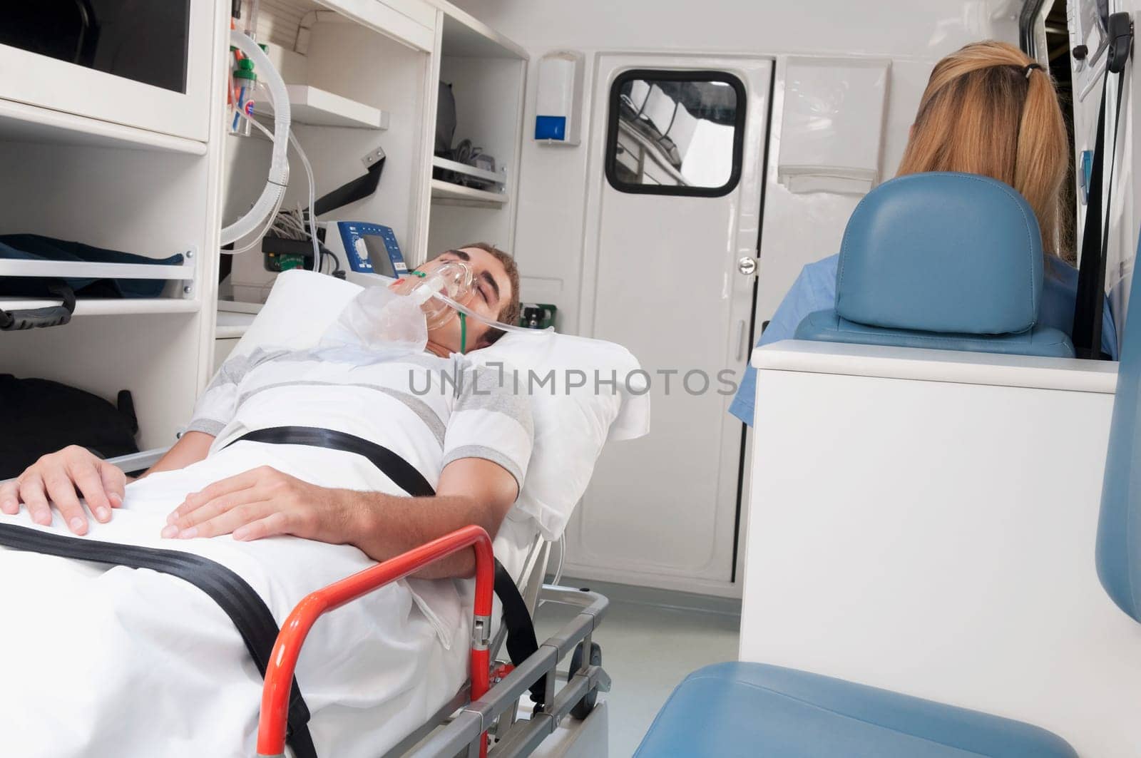 Patient with a female nurse in an ambulance