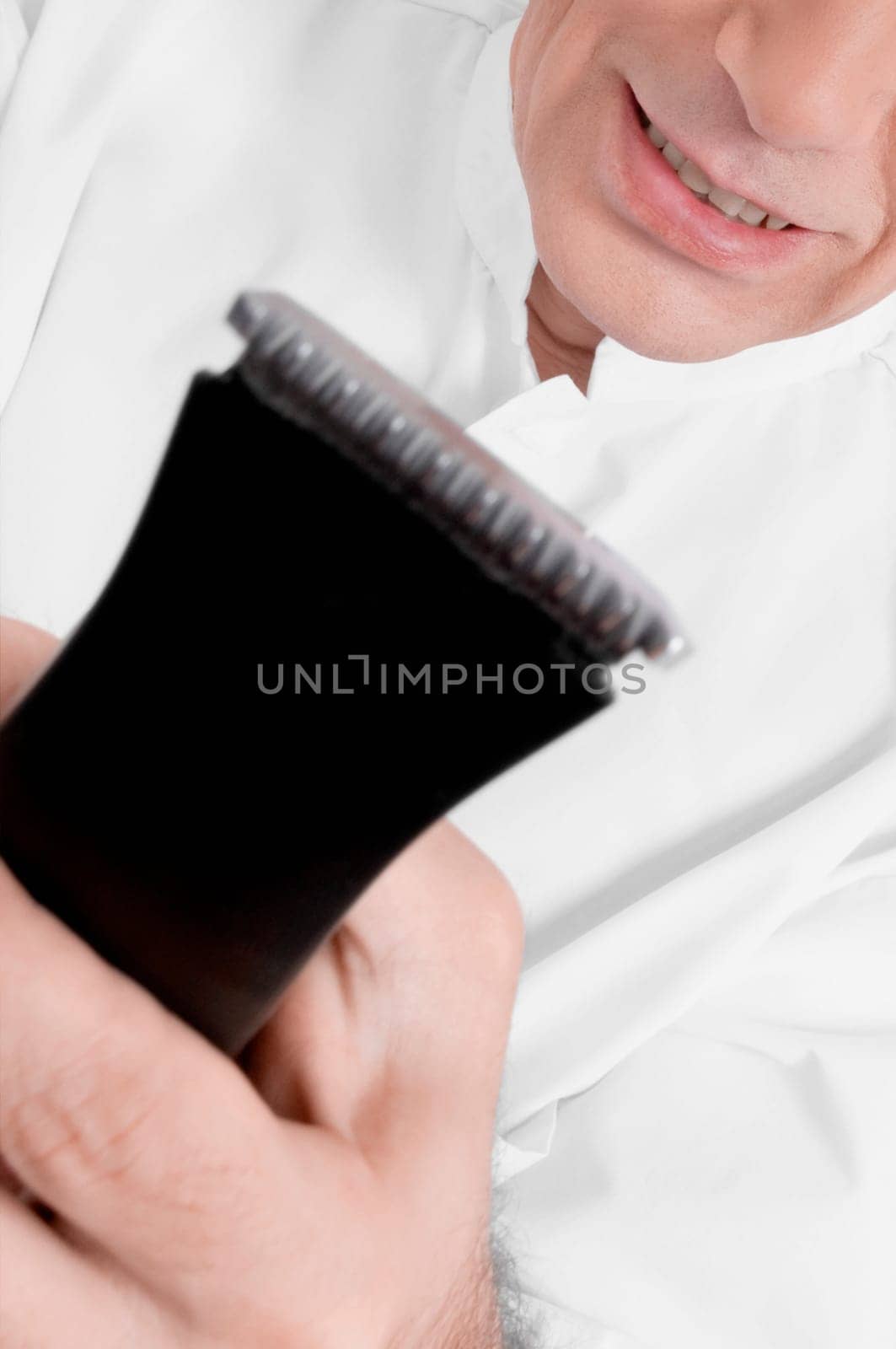 Vet holding an electric razor