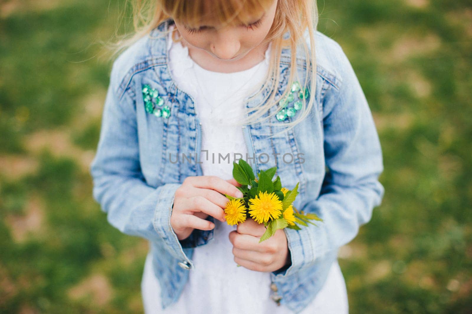 Small girl is holding Small girl is holding a bouquet with yellow flowers. High quality photoa bouquet with yellow flowers. High quality photo