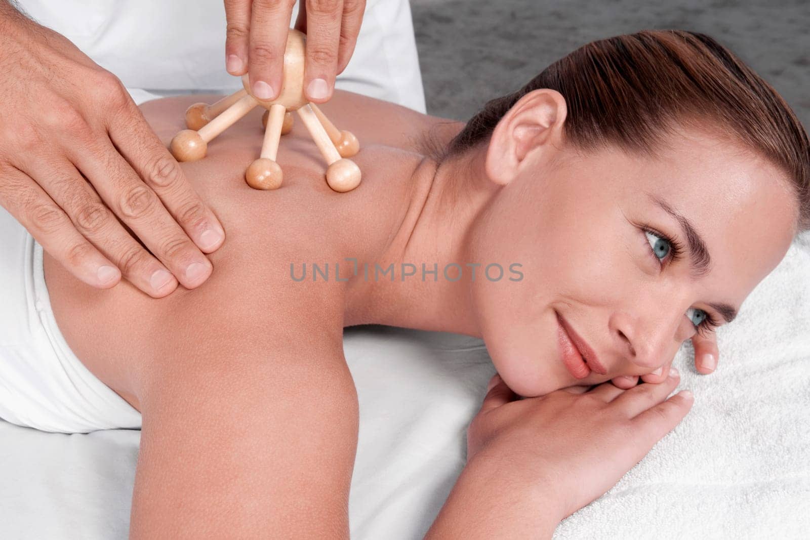 Woman receiving acupressure treatment