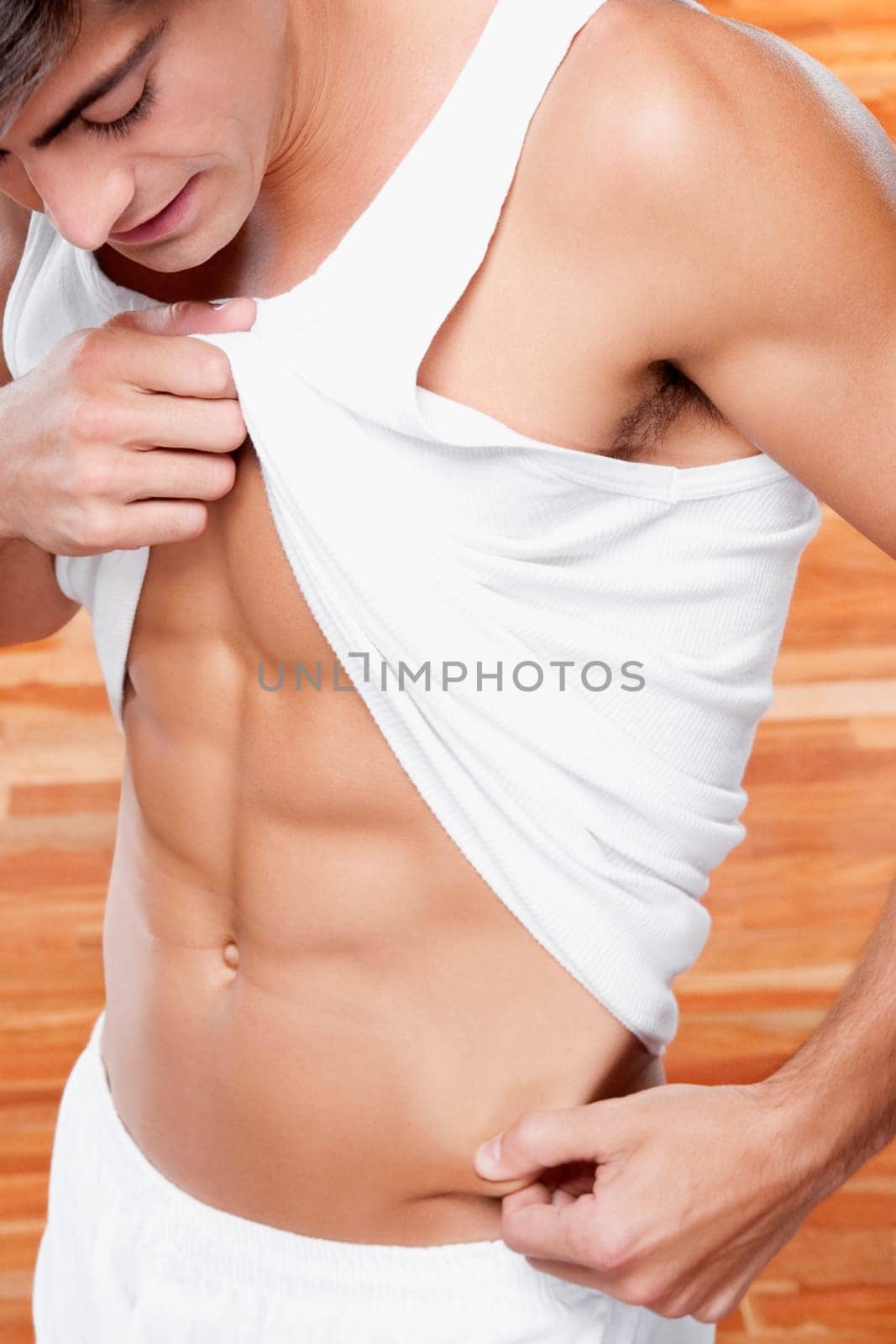 Man pinching his waist skin