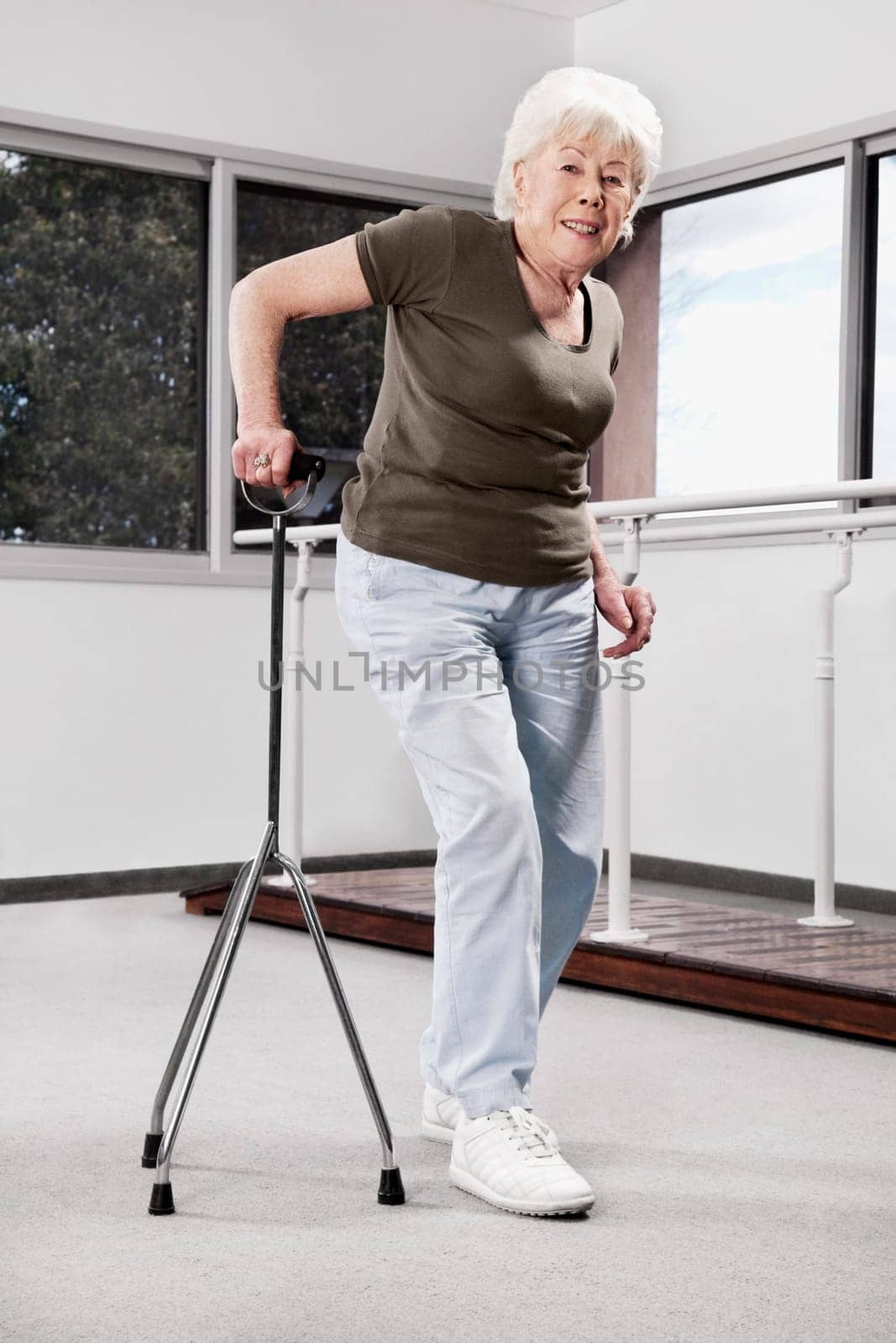 Disabled woman walking with a cane
