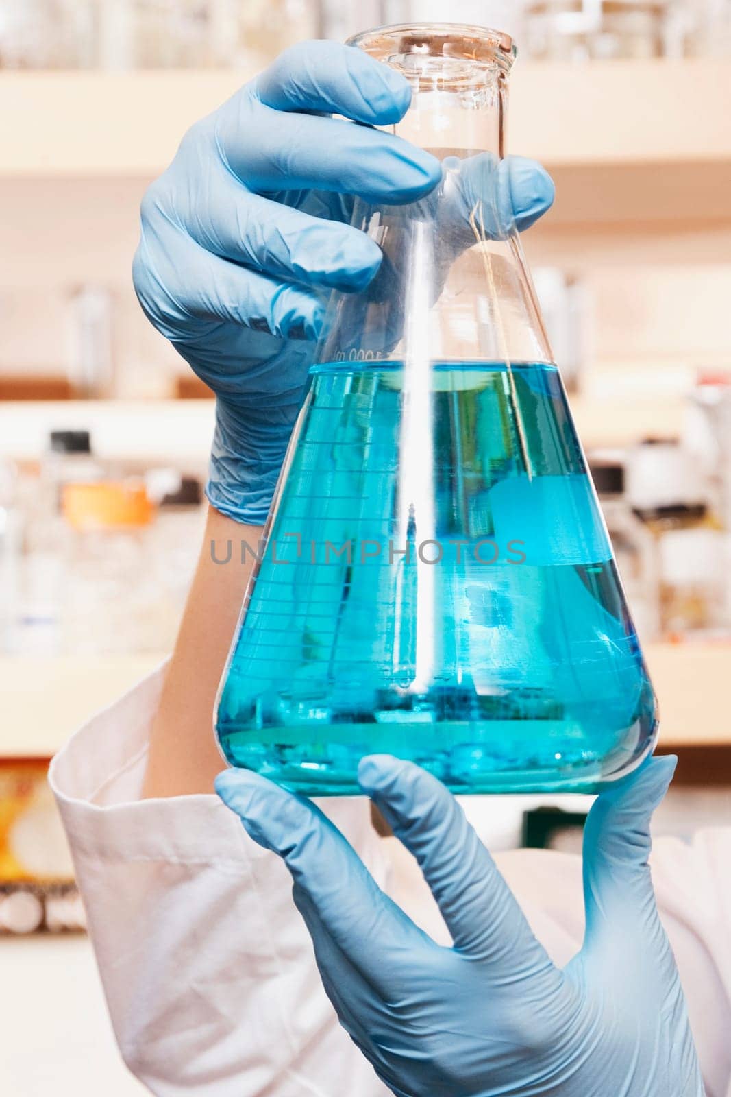 Female doctor holding a conical flask in a laboratory