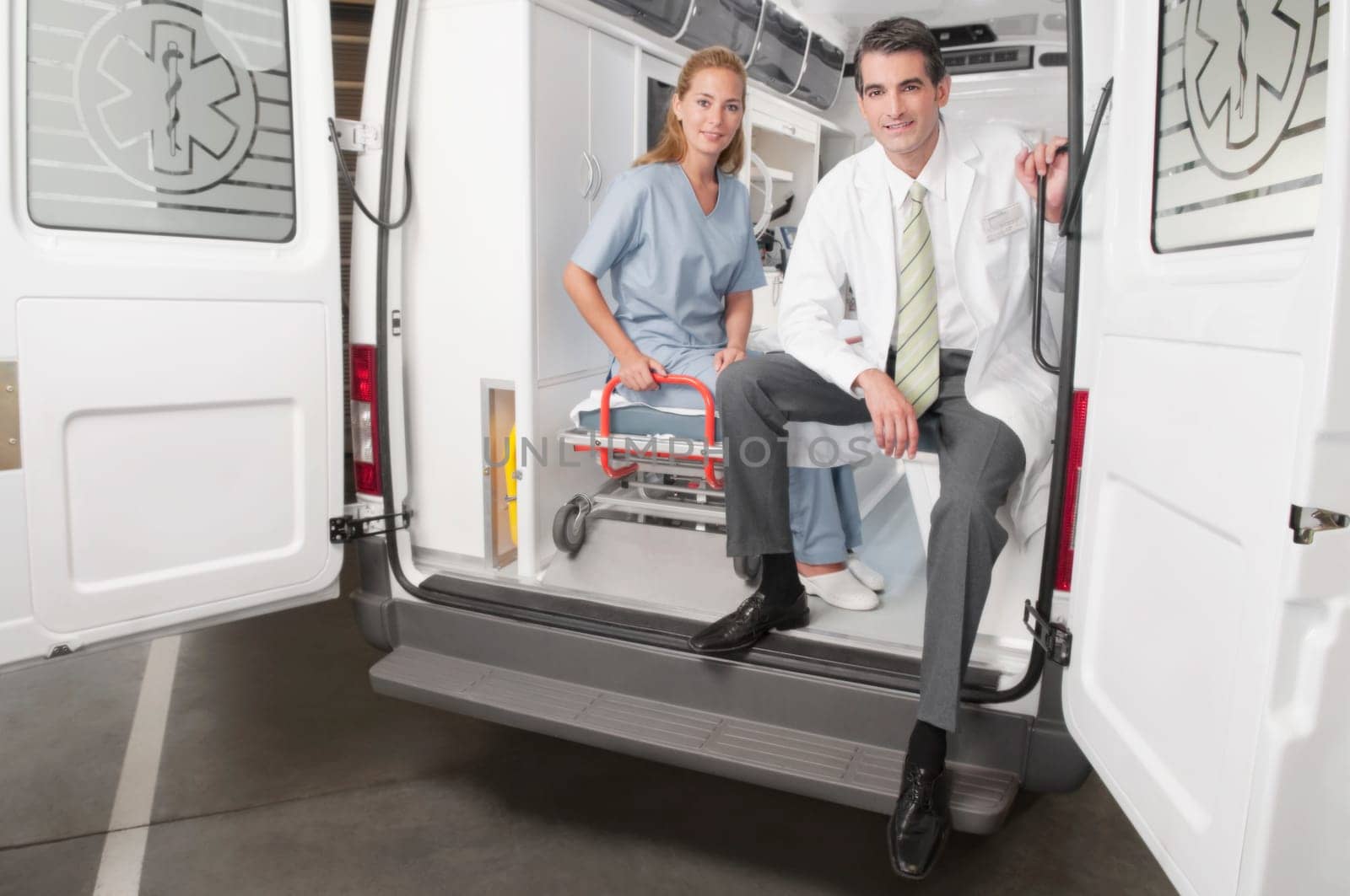 Doctor with a female nurse in an ambulance