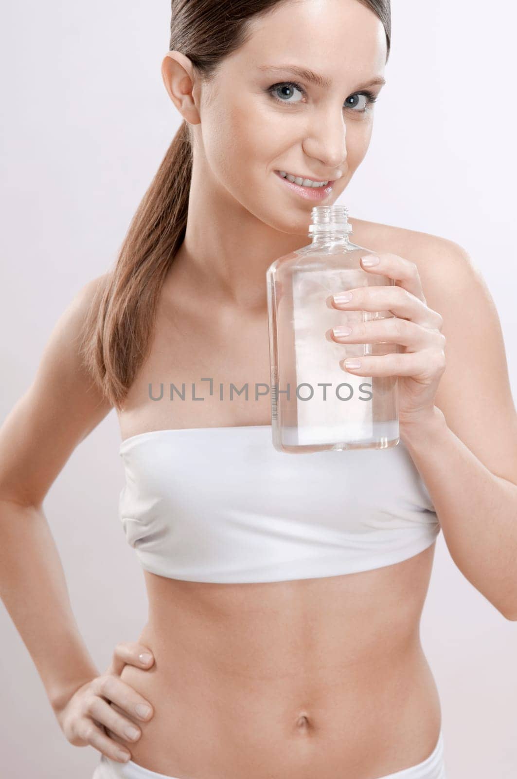 Woman smelling aromatherapy oil