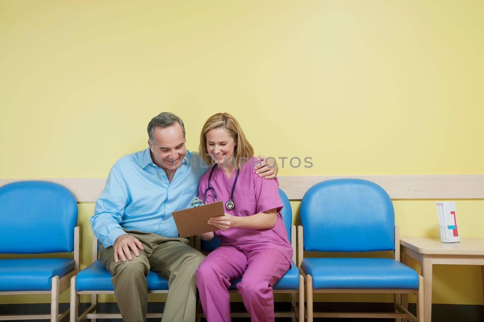 Female nurse showing a medical report to a patient