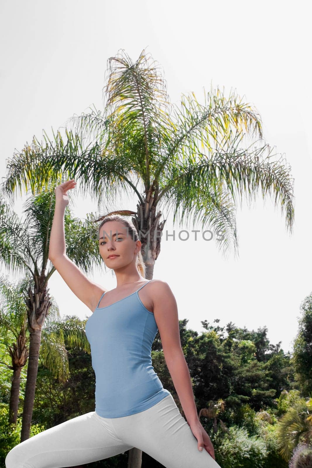 Woman practicing yoga in a park