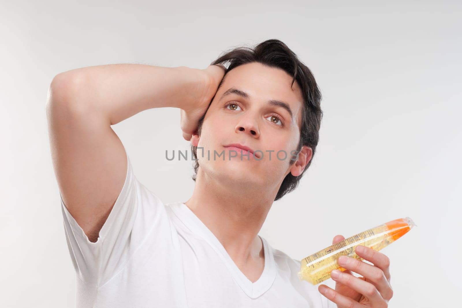 Man applying gel on his hair