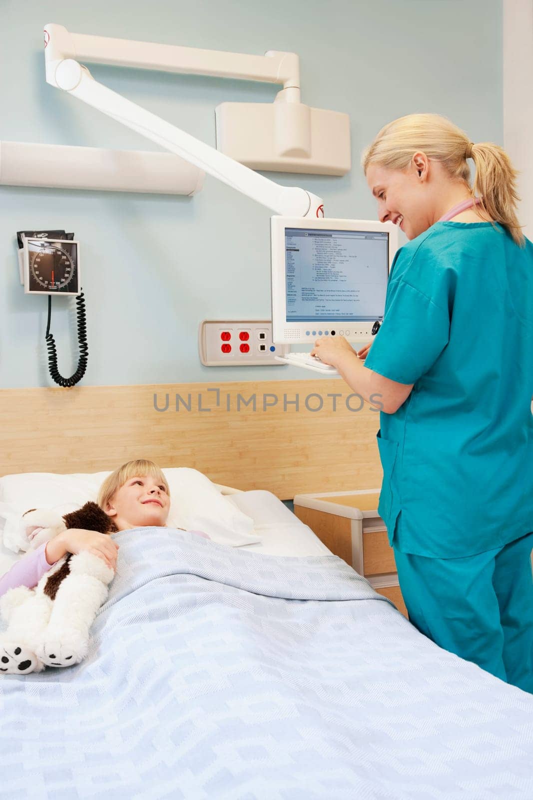 Female doctor working on a cardiac monitor