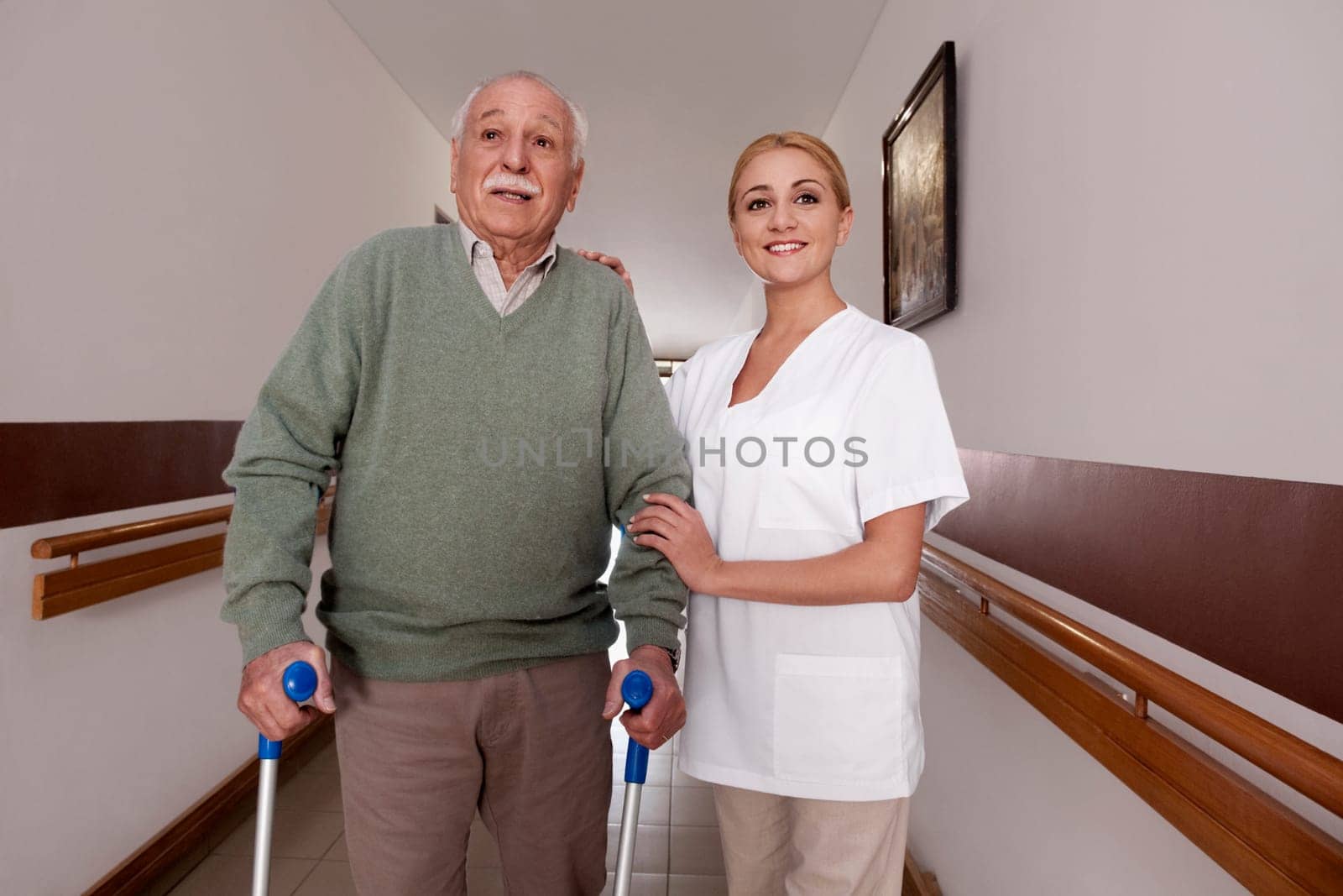 Nurse assisting a man to walk