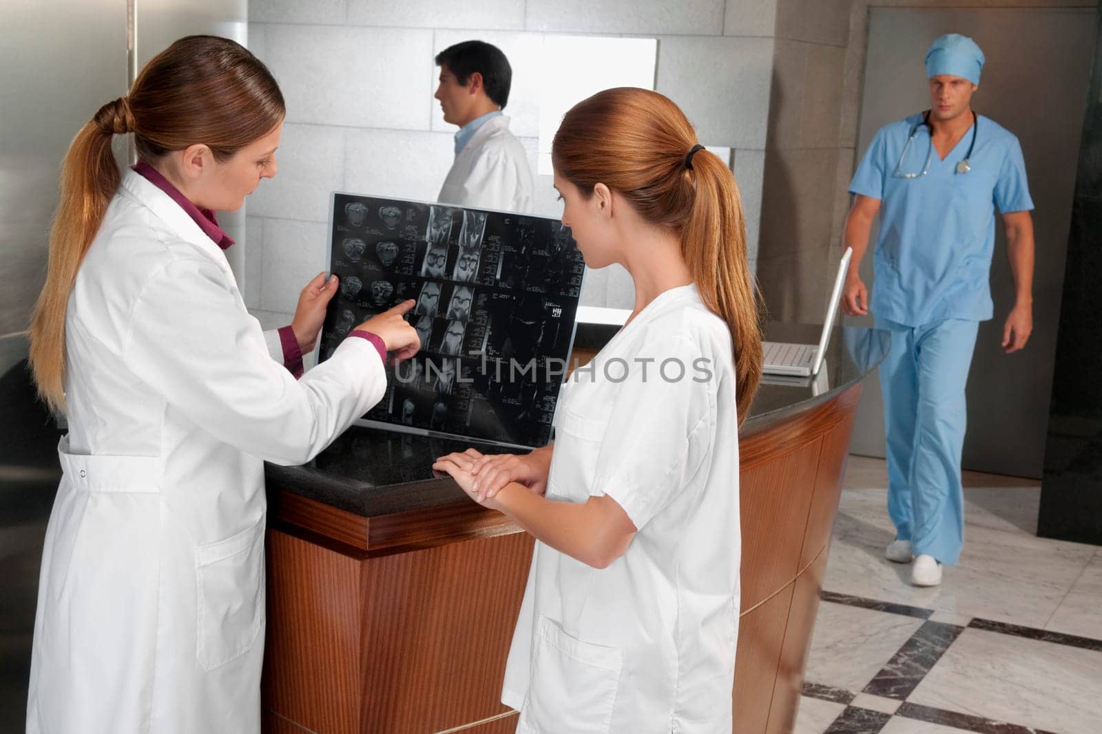 Two female doctors examining an X_Ray report