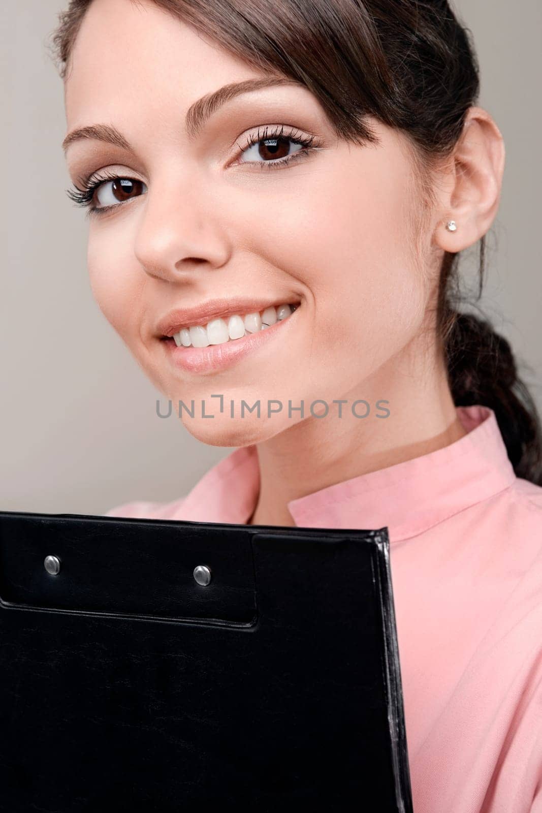 Female doctor holding a clipboard