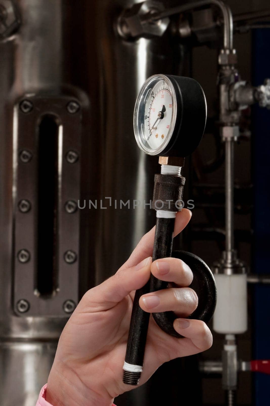 Female doctor holding a pressure gauge in a laboratory