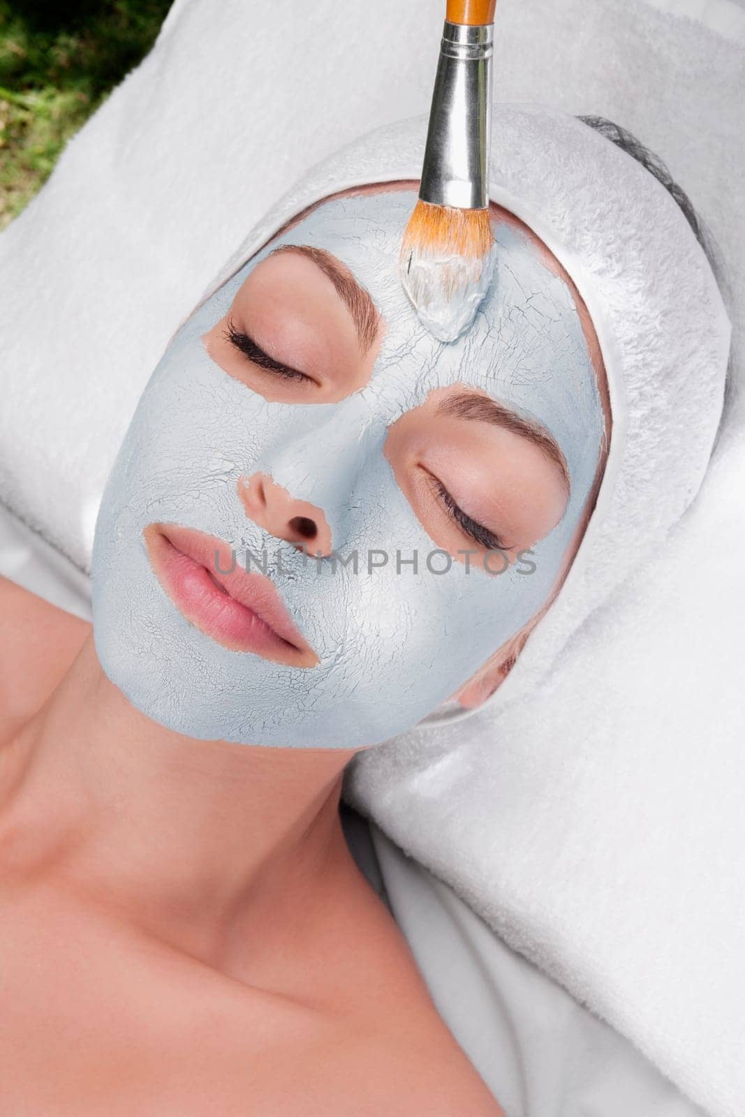 Woman applying face pack