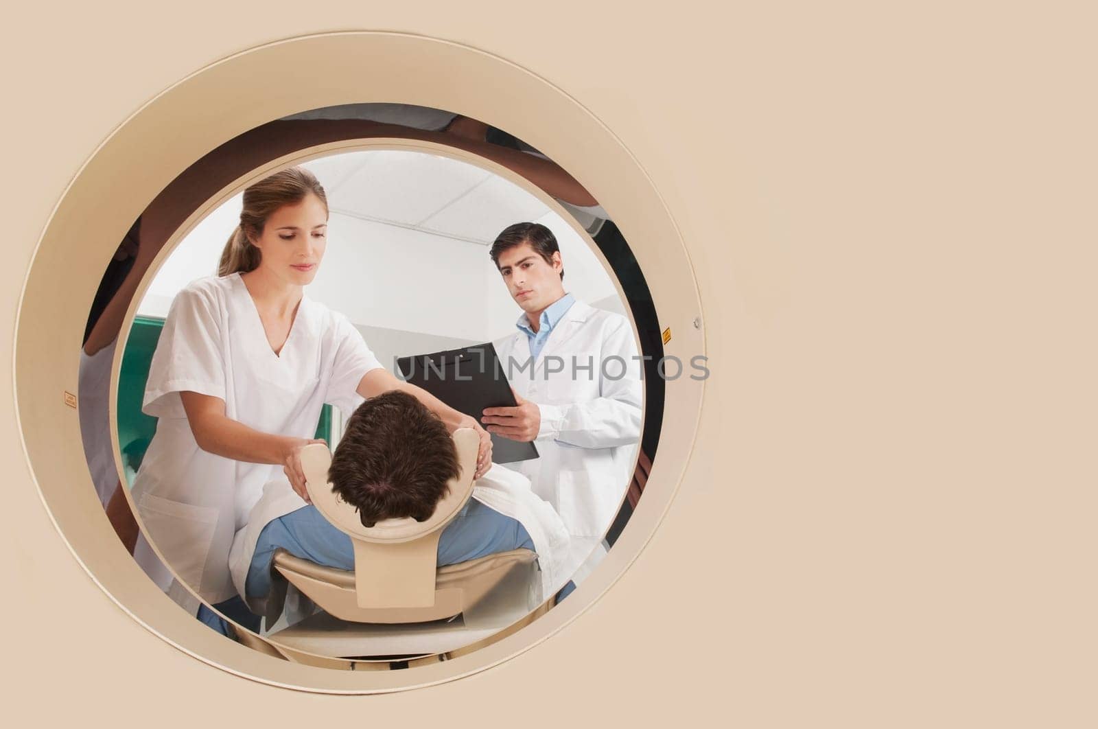 Doctor and nurse preparing a patient for MRI scan