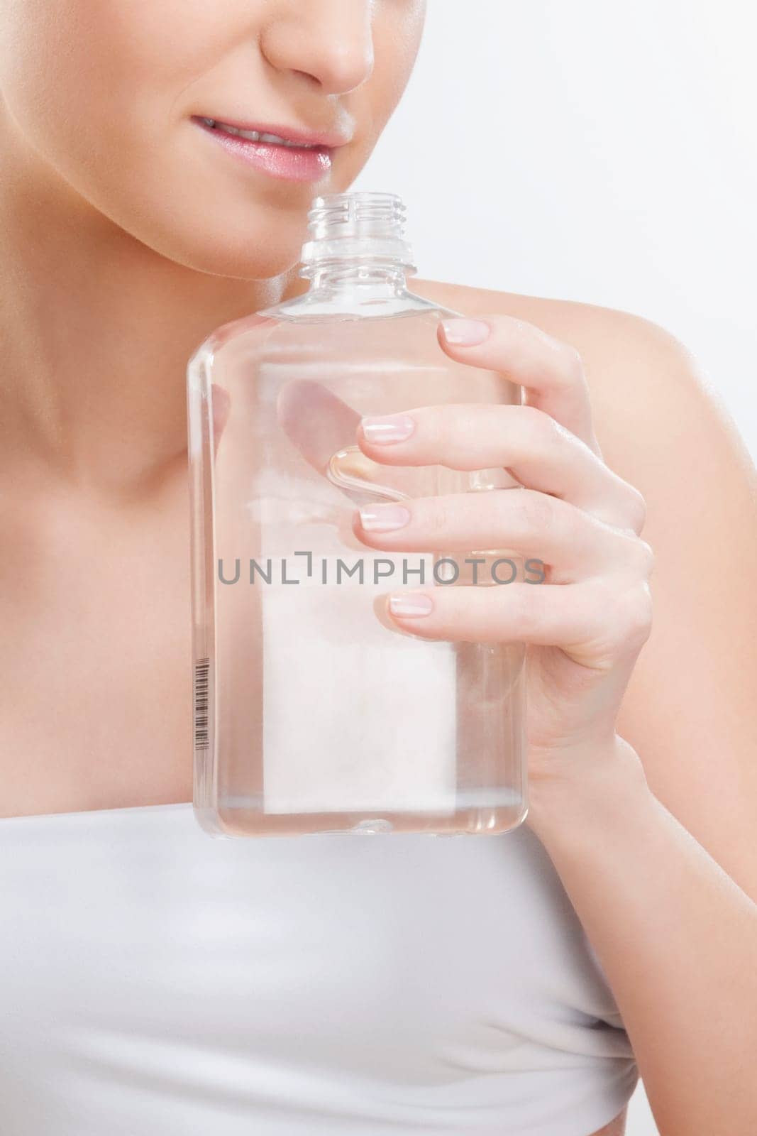 Woman smelling aromatherapy oil