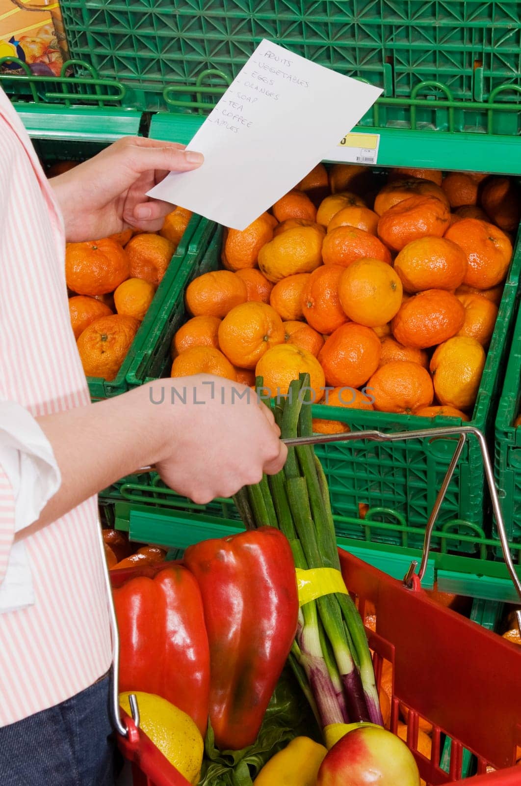 Woman shopping vegetables in a supermarket