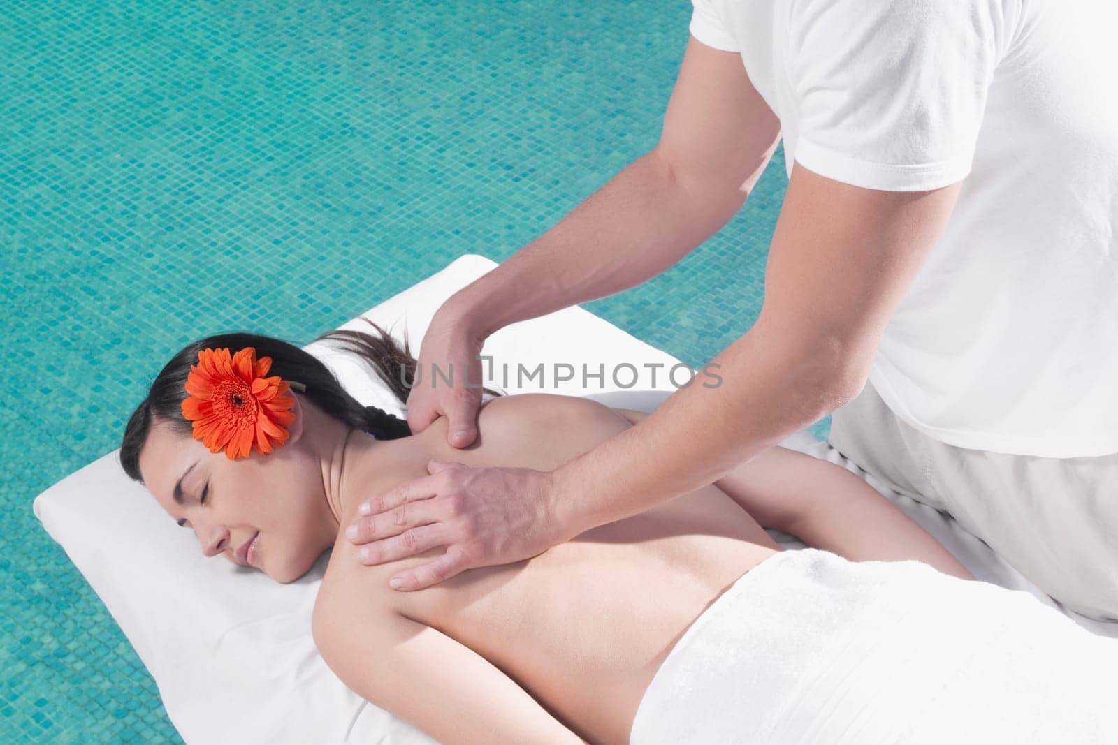 Woman receiving back massage from a massage therapist