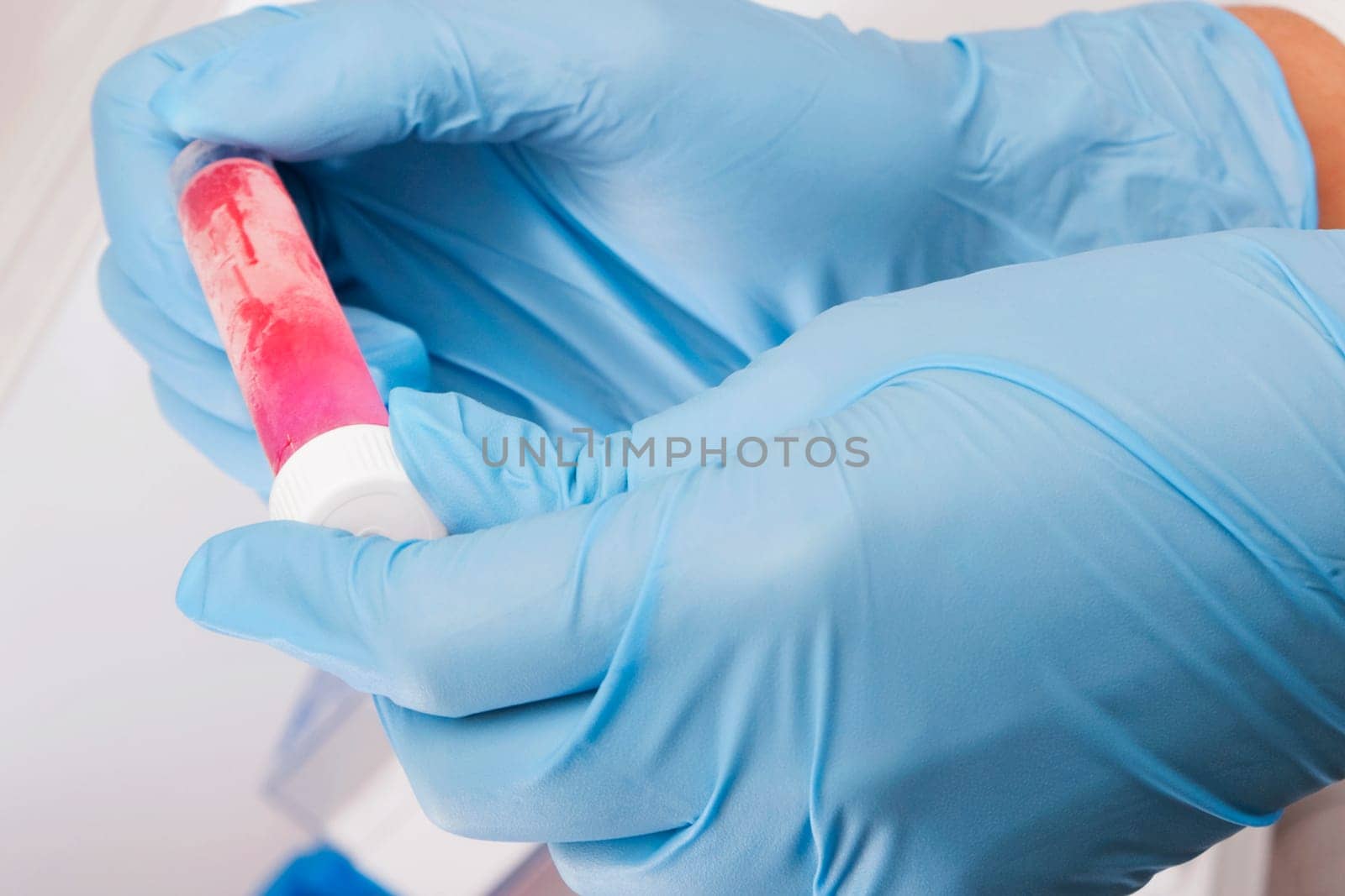 Doctor holding a medical sample in a laboratory