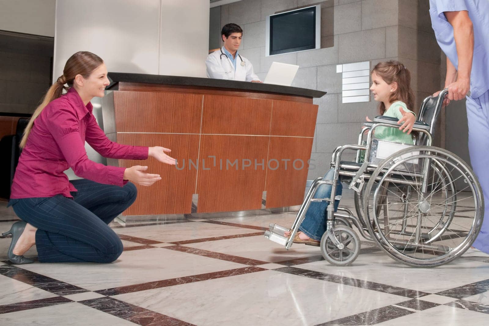 Woman assisting her daughter to walk