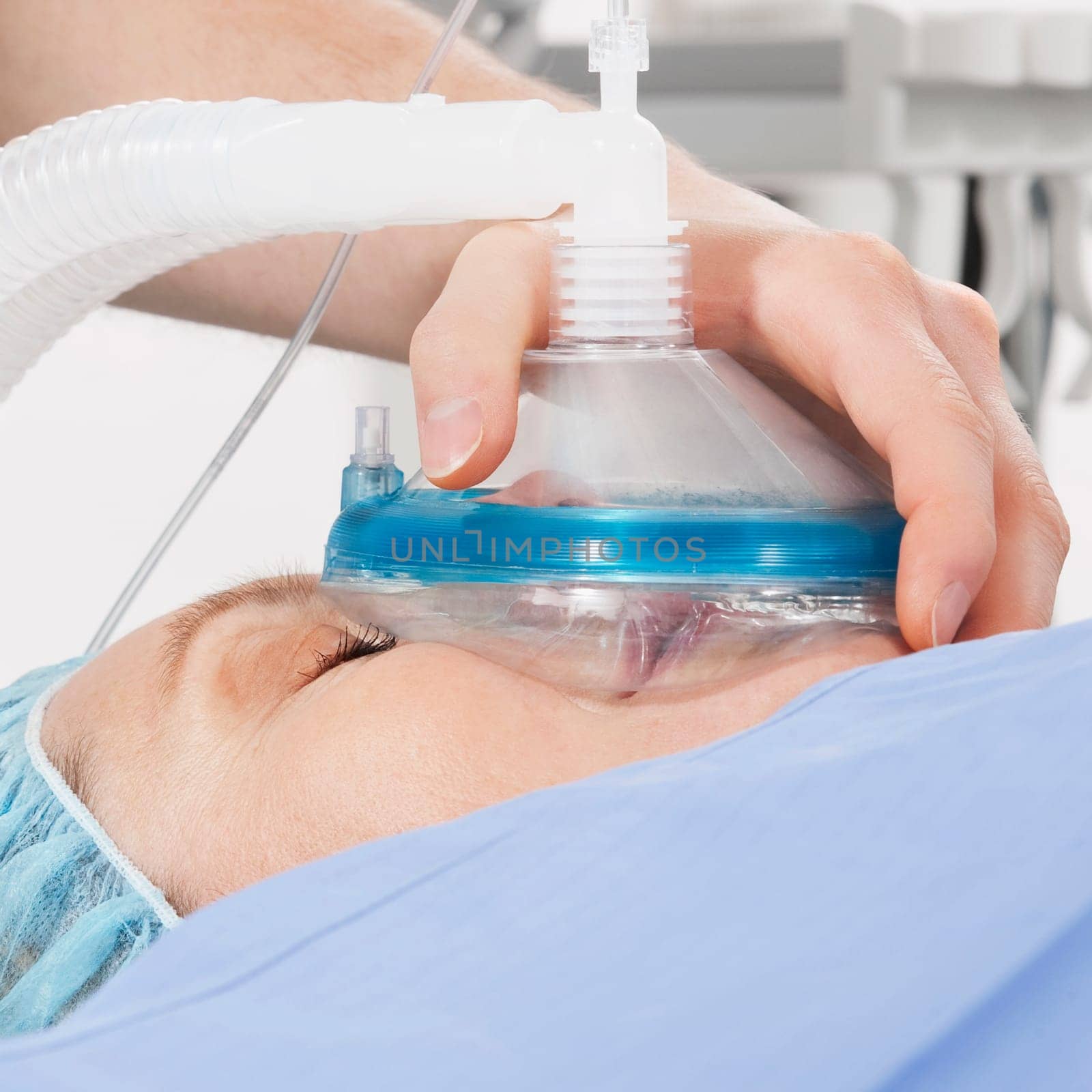 Anesthetist holding oxygen mask over patientŽs mouth in hospital