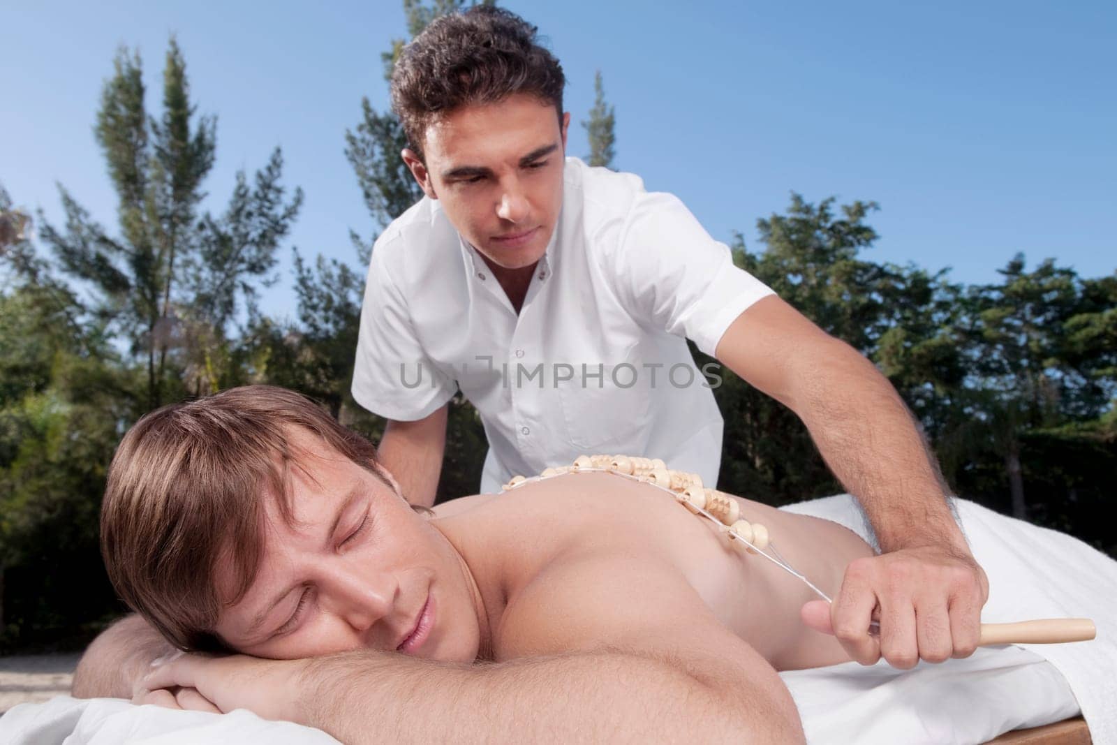 Man receiving acupressure treatment