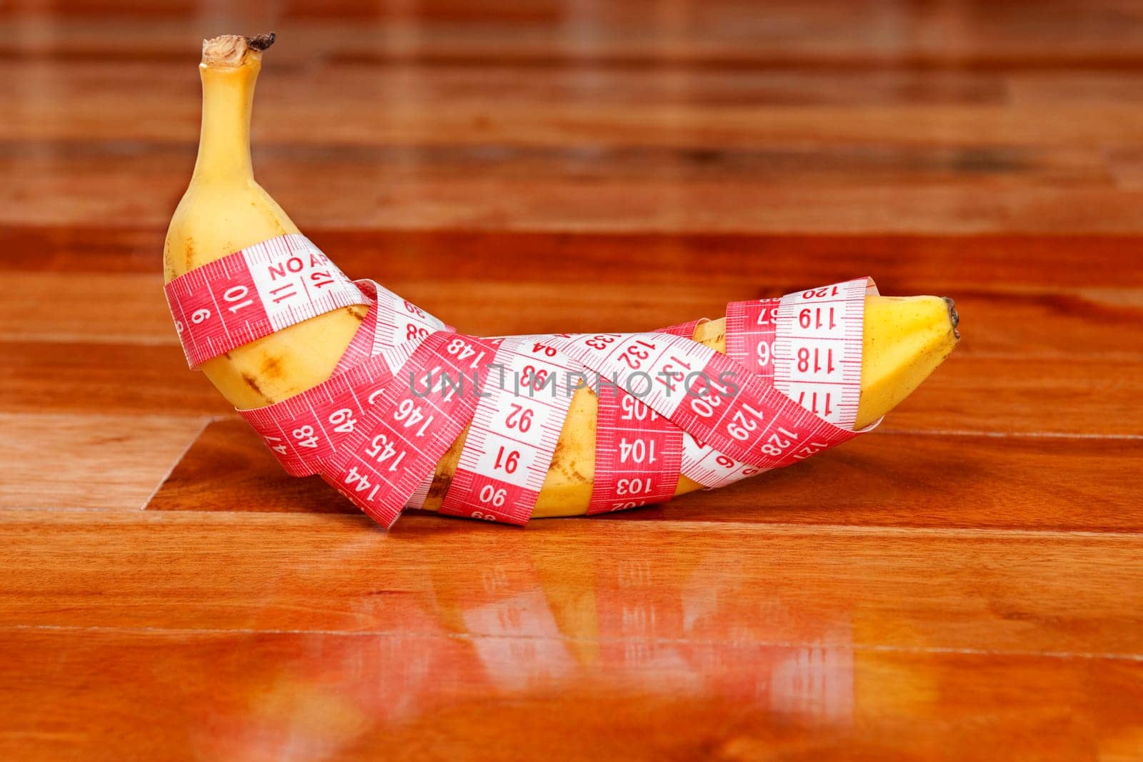 Banana wrapped in a tape measure
