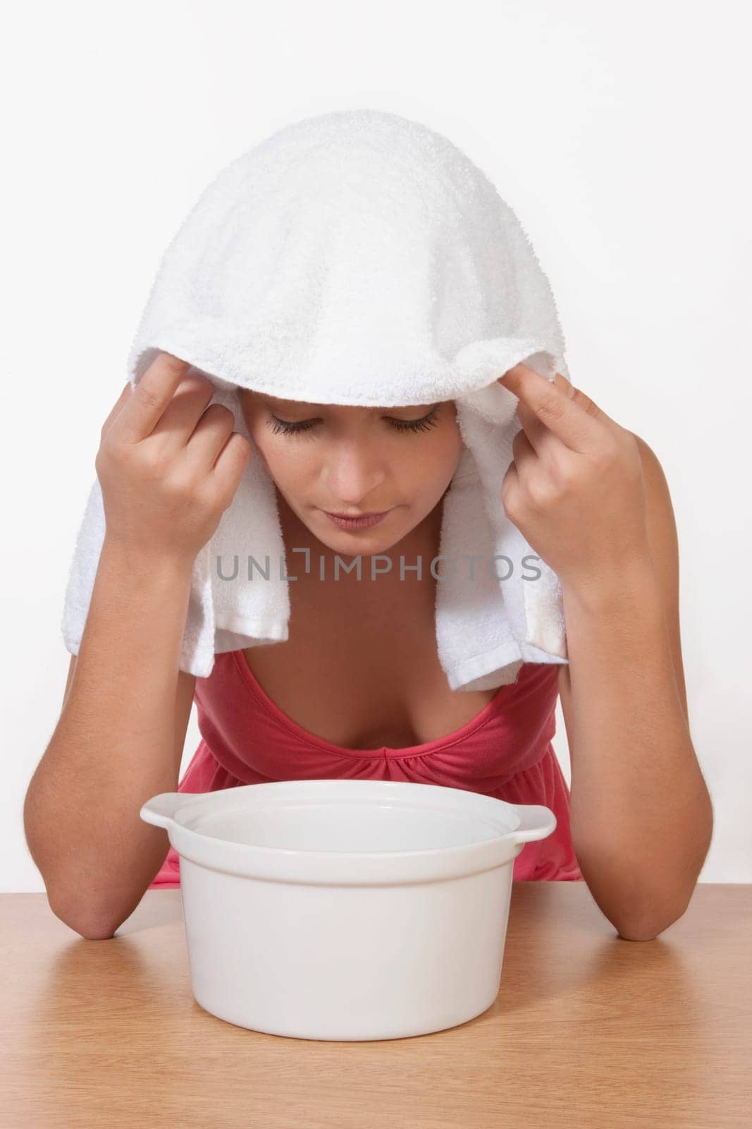 Woman inhaling steam