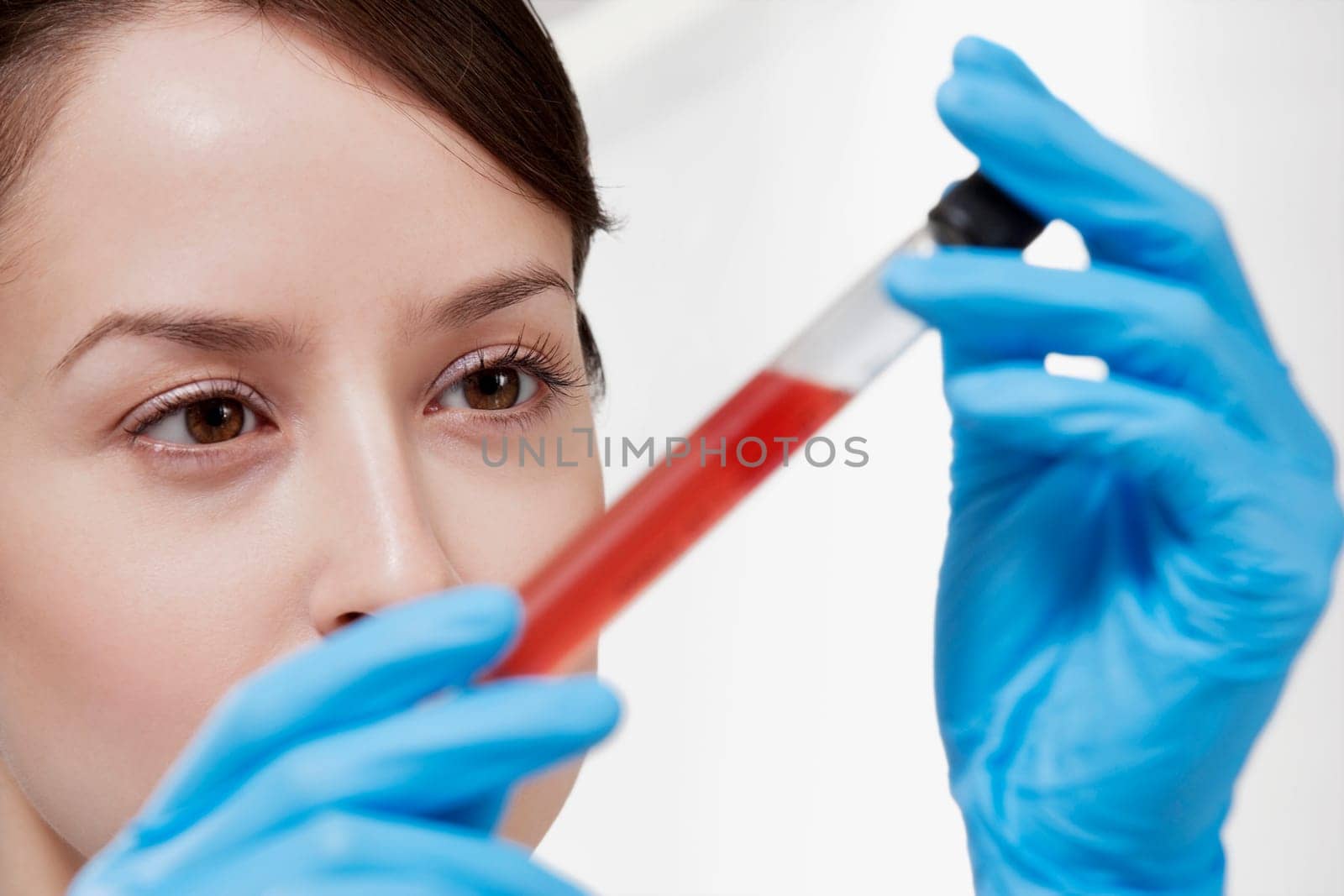 Female doctor holding a medical sample in a laboratory