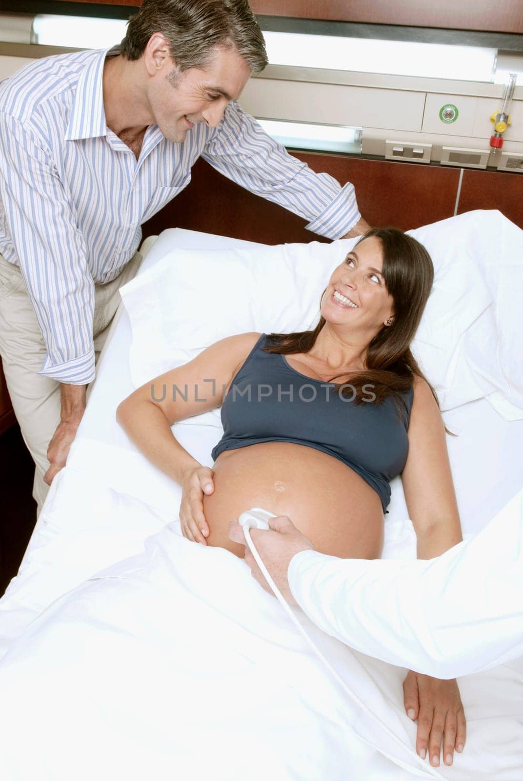 Pregnant woman going through an ultrasound scan