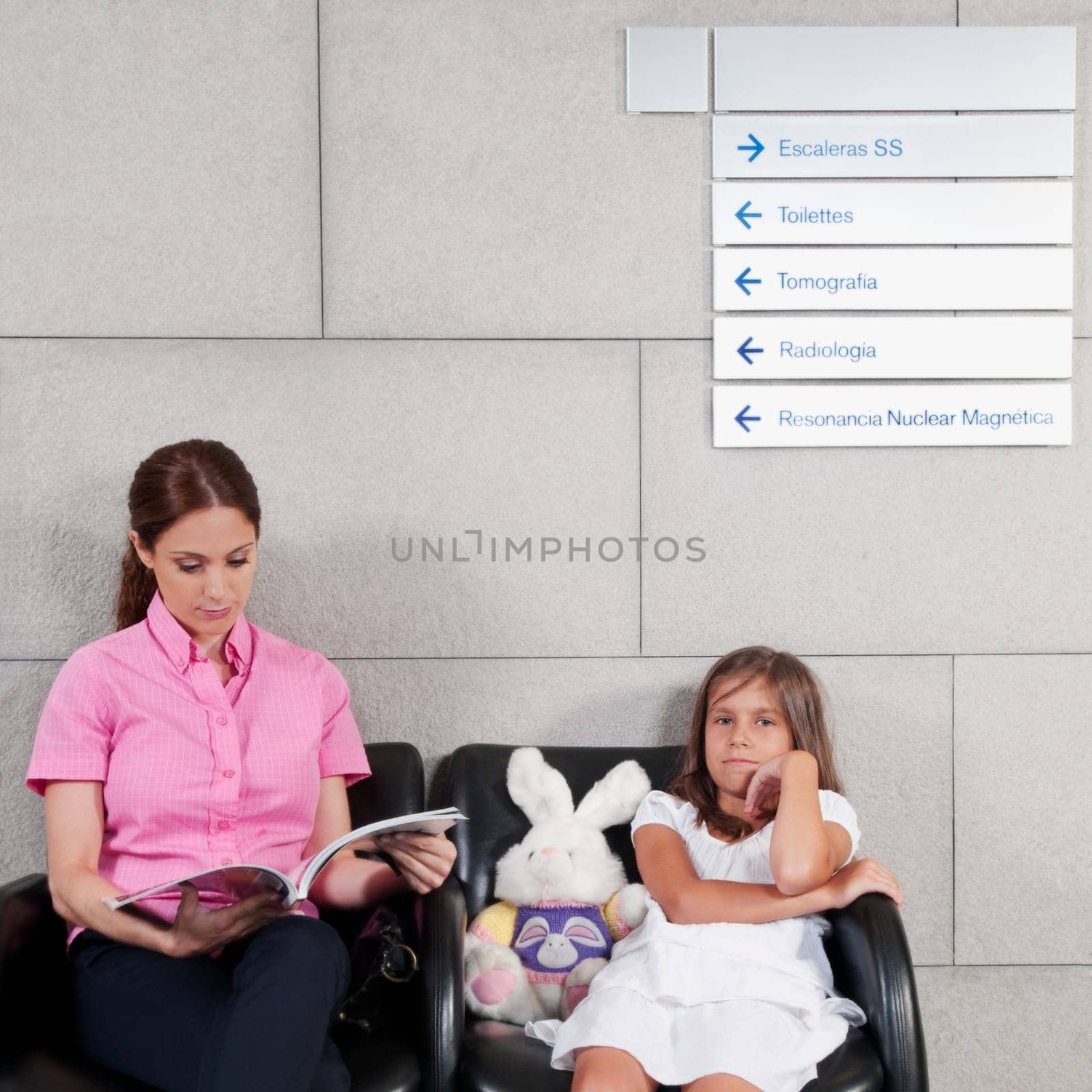 Woman with her daughter in a hospital waiting room