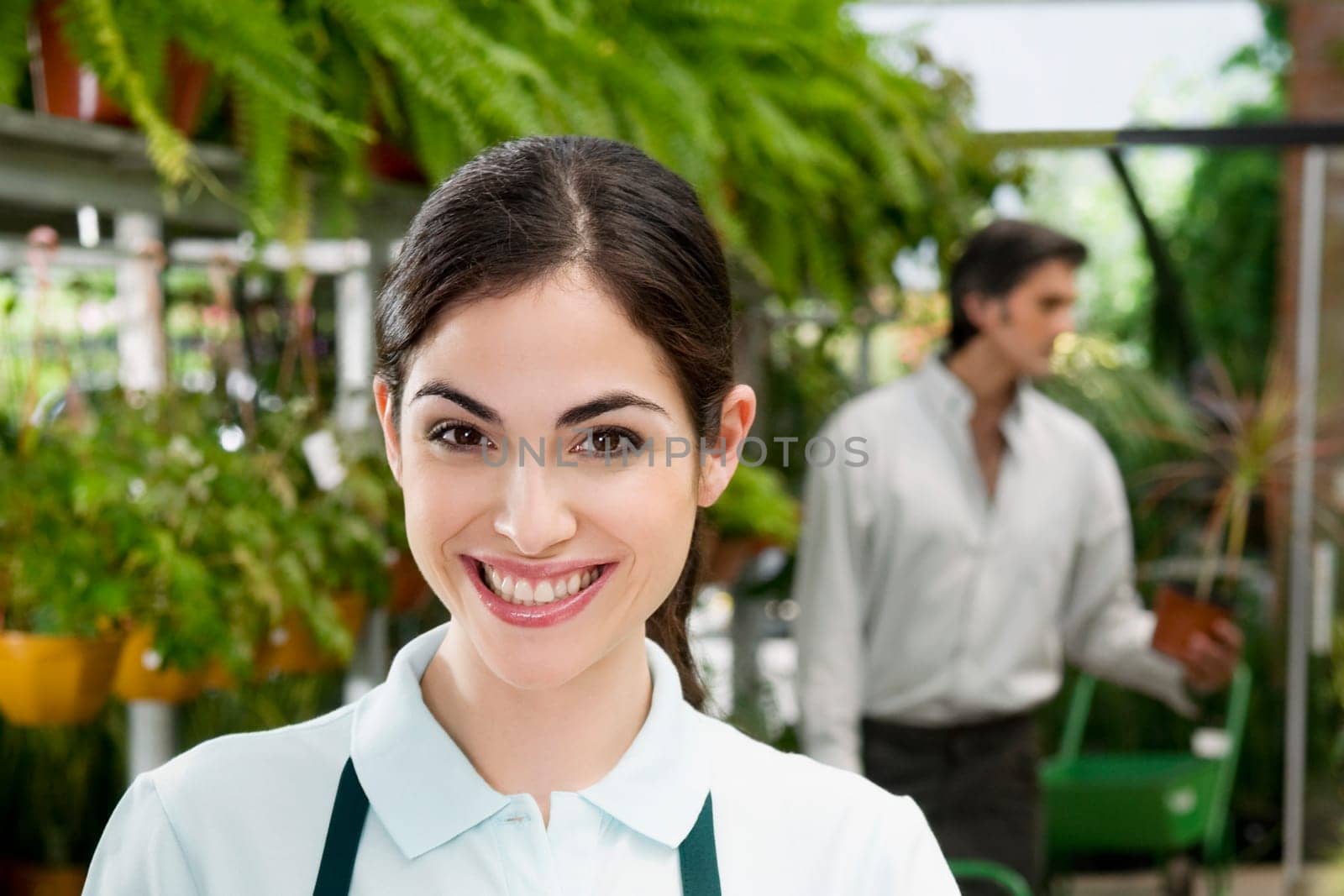 Portrait of a woman in a greenhouse