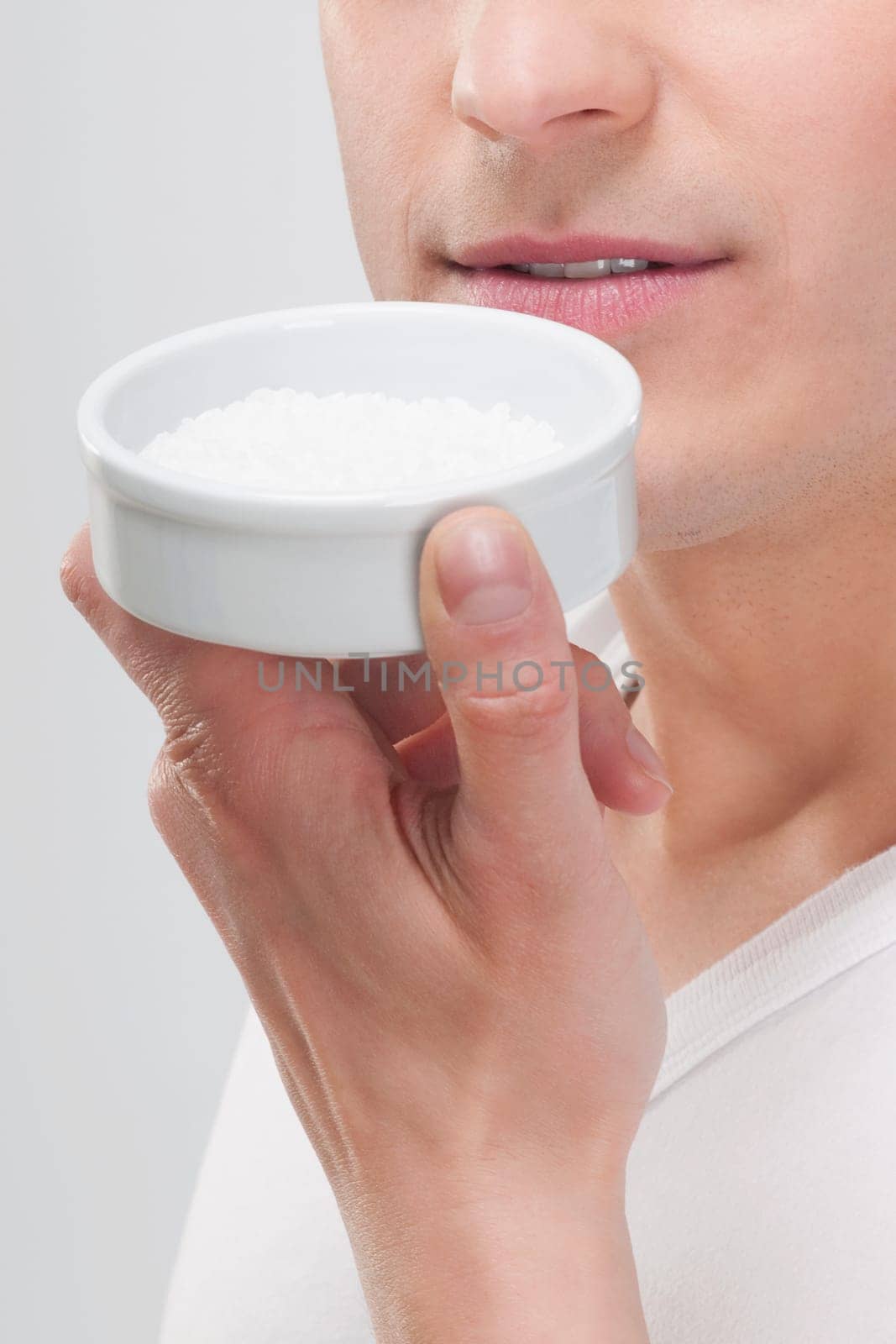 Man smelling bath salt