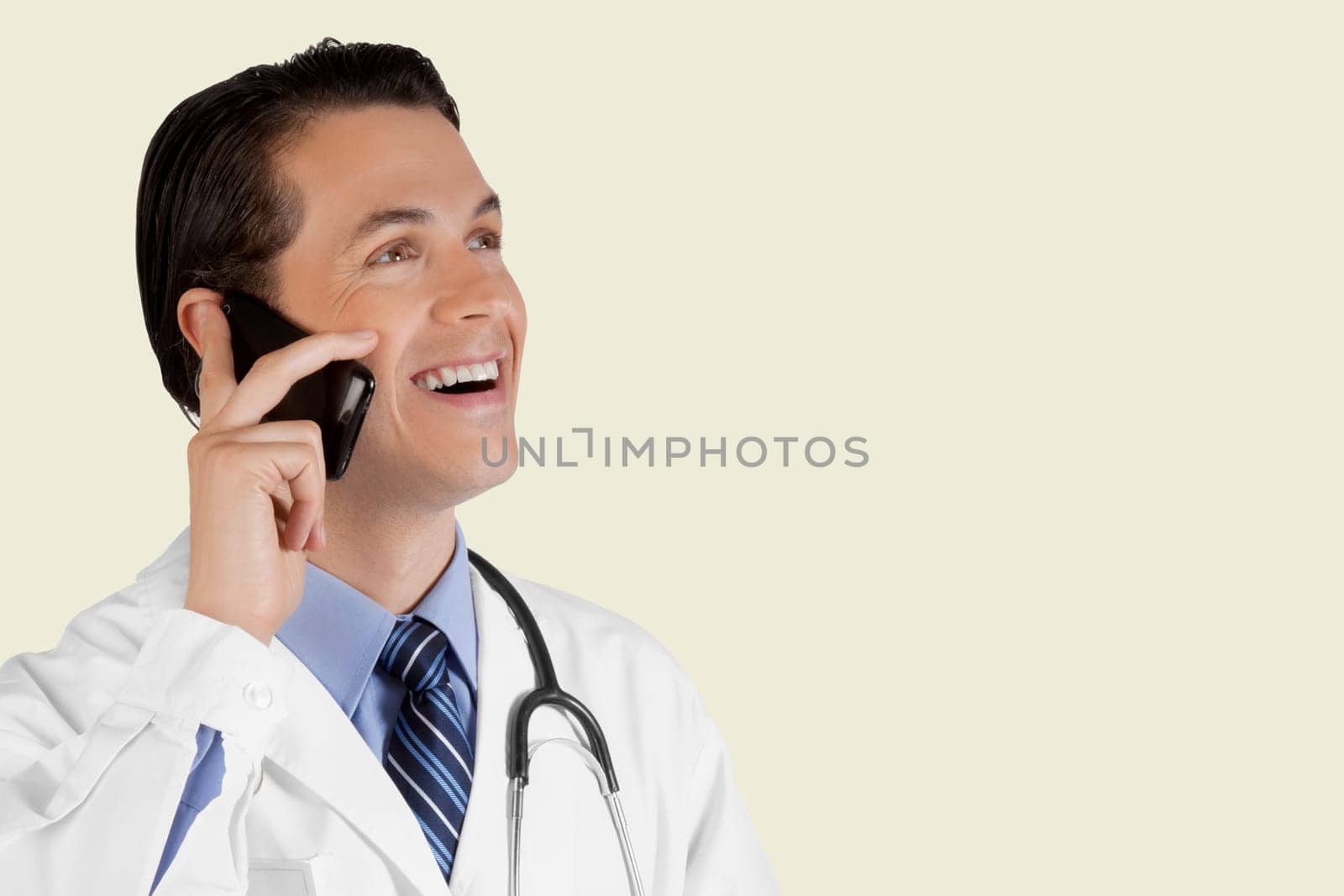 Close_up of a doctor talking on a mobile phone