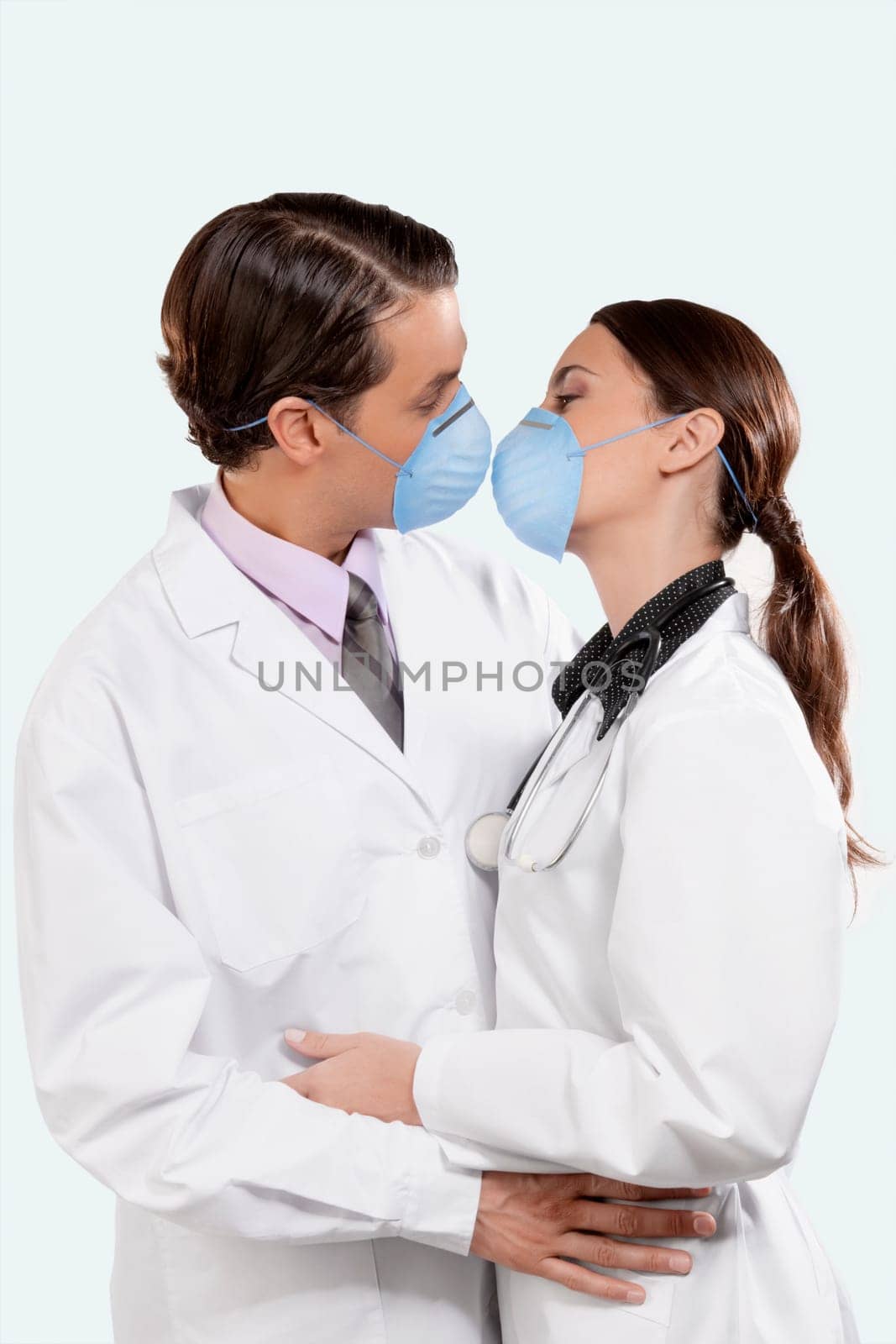 Doctors wearing flu masks and romancing