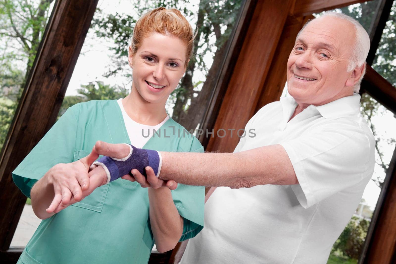 Health worker putting on wrist brace to a man