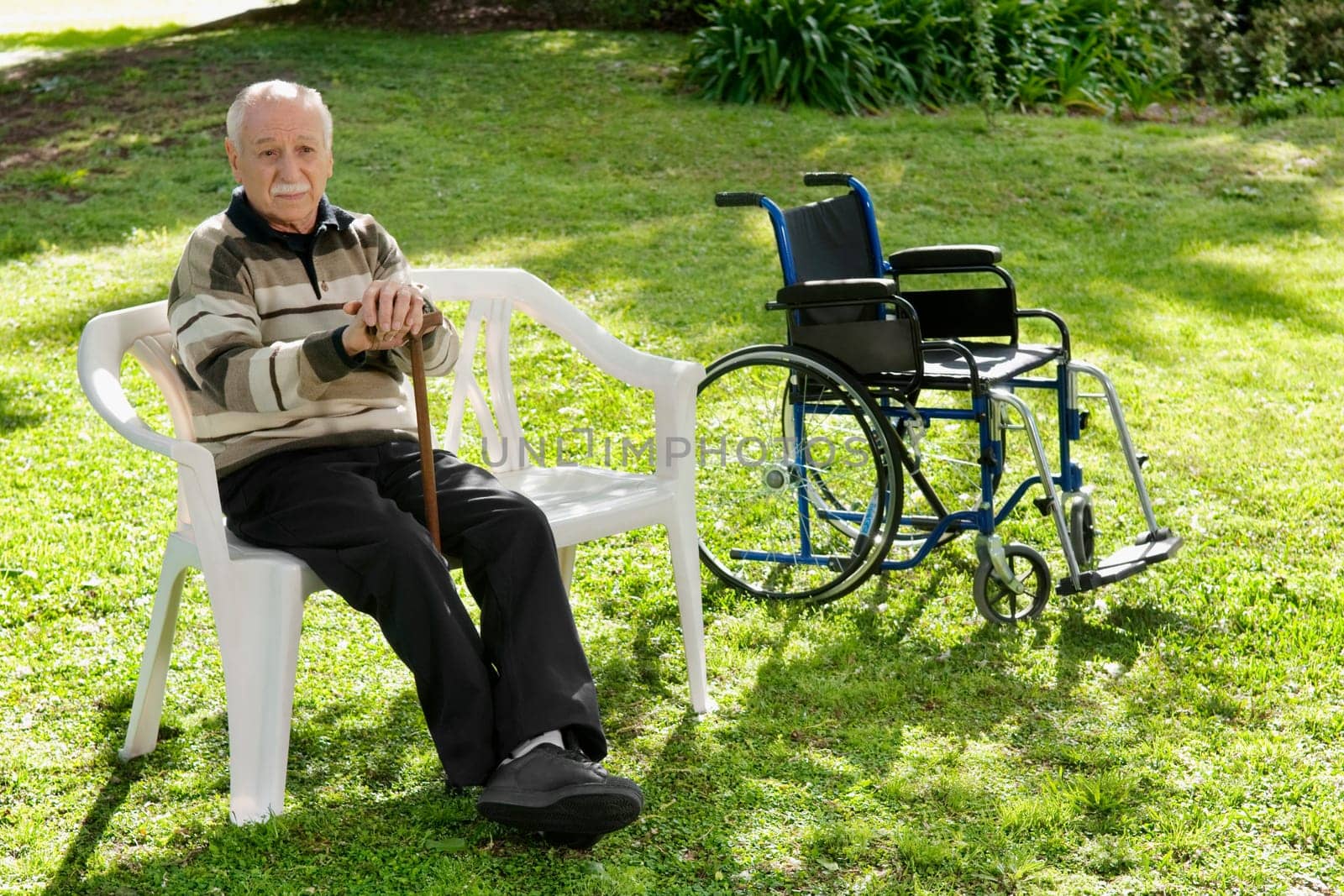 Man sitting on a chair in a park