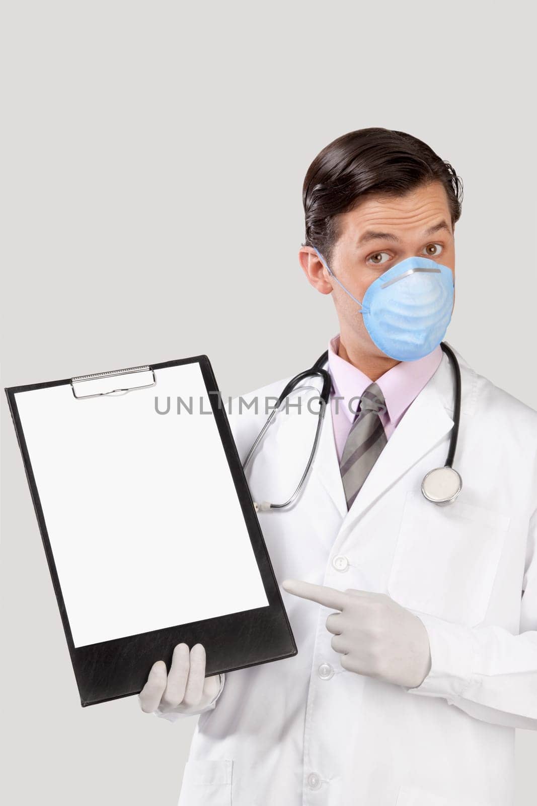 Doctor wearing a flu mask and showing a clip board