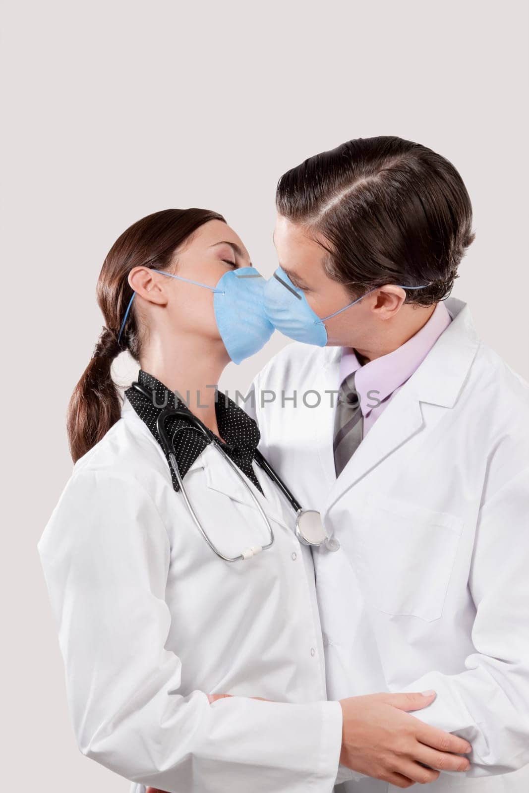 Doctors wearing flu masks and romancing