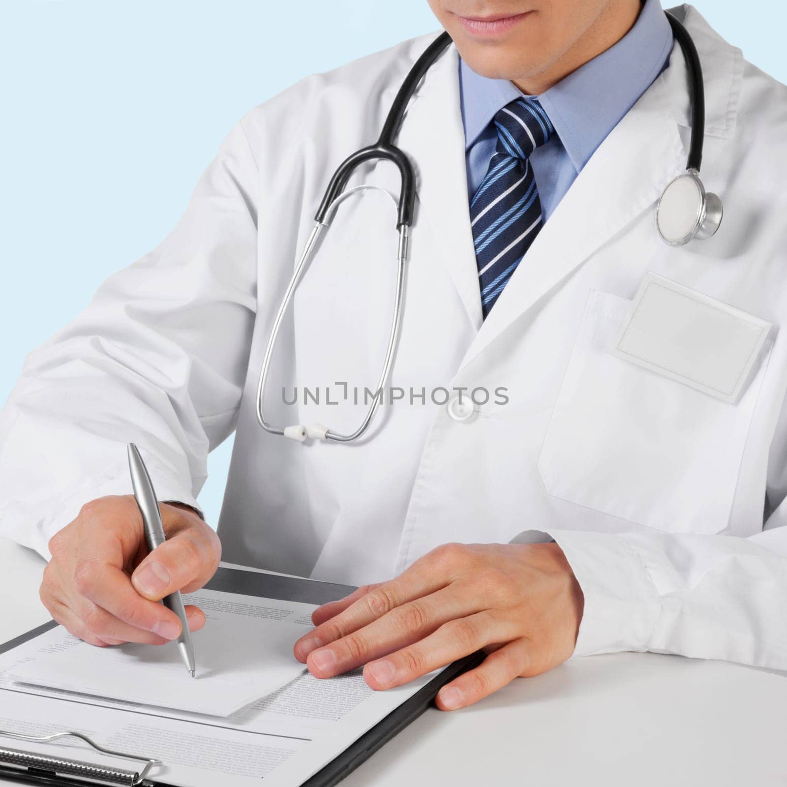 Doctor writing on a clipboard