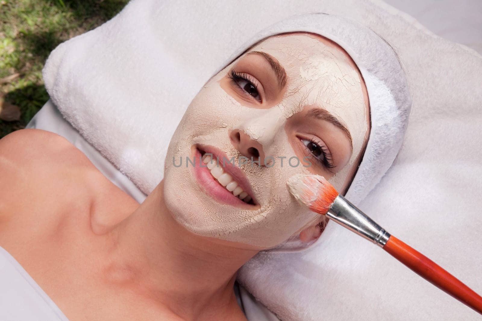 Woman applying face pack