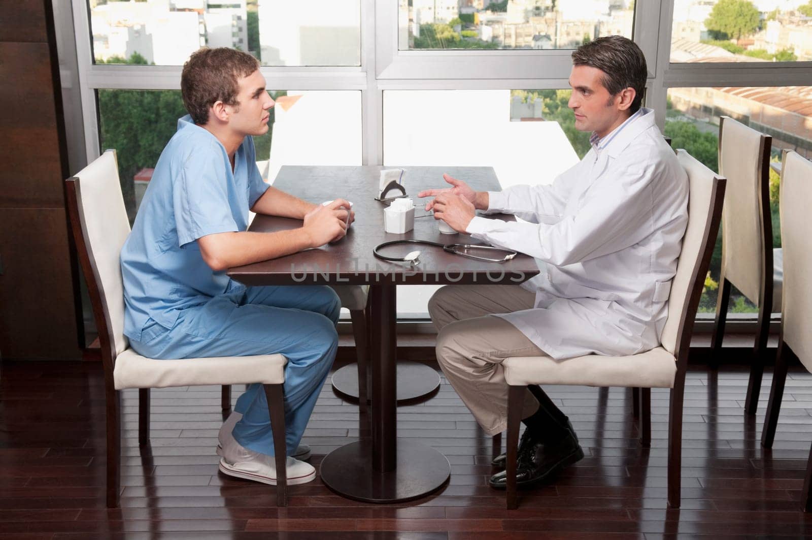 Doctors discussing in a cafeteria