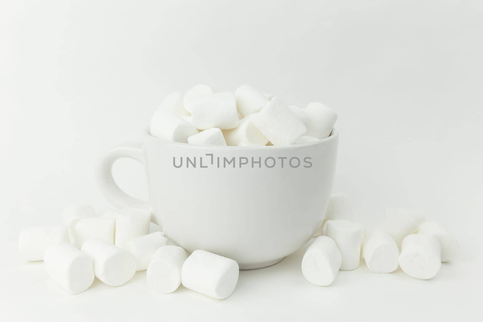 Marshmallow in the cup on the white background. High quality photo