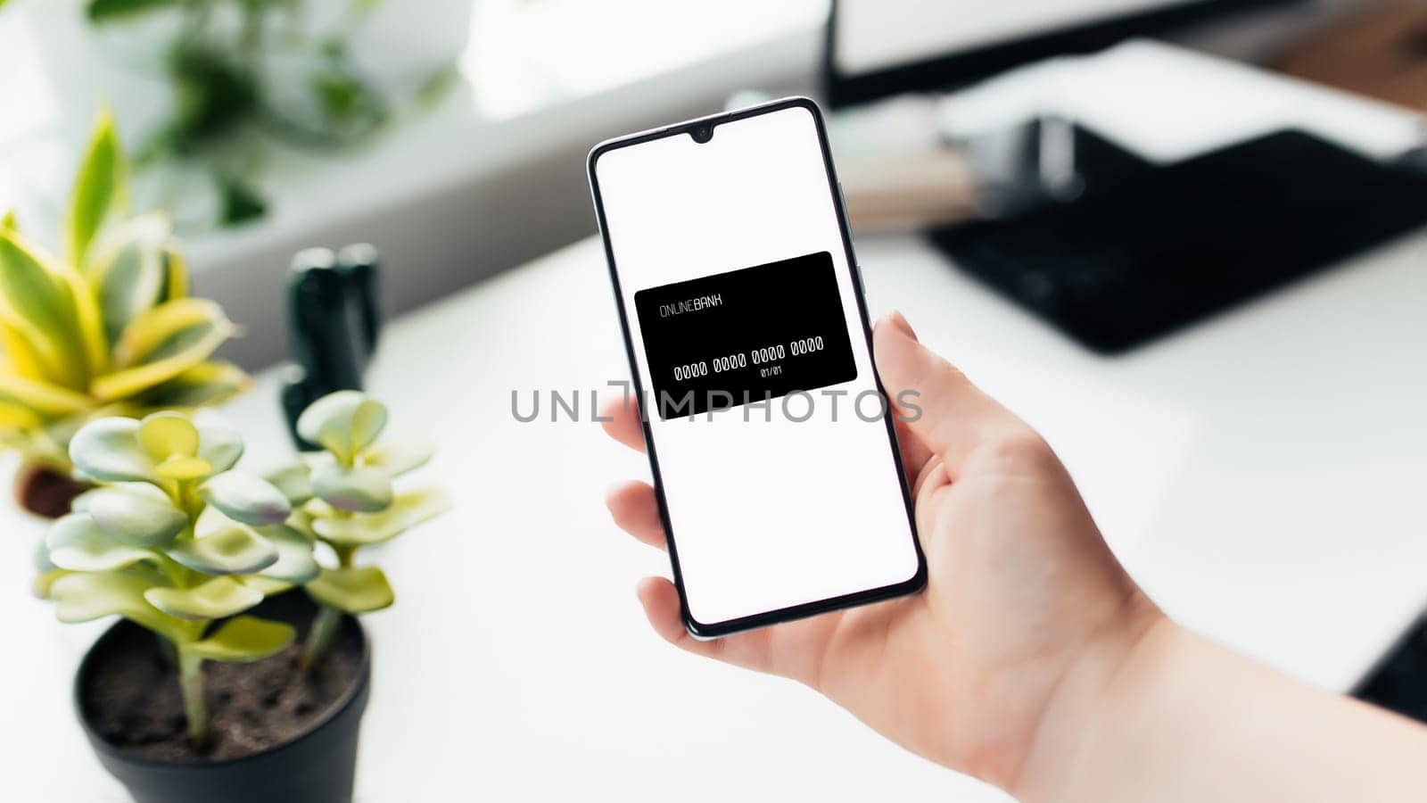 Smartphone in the hand, work from home, office stuff. High quality photo