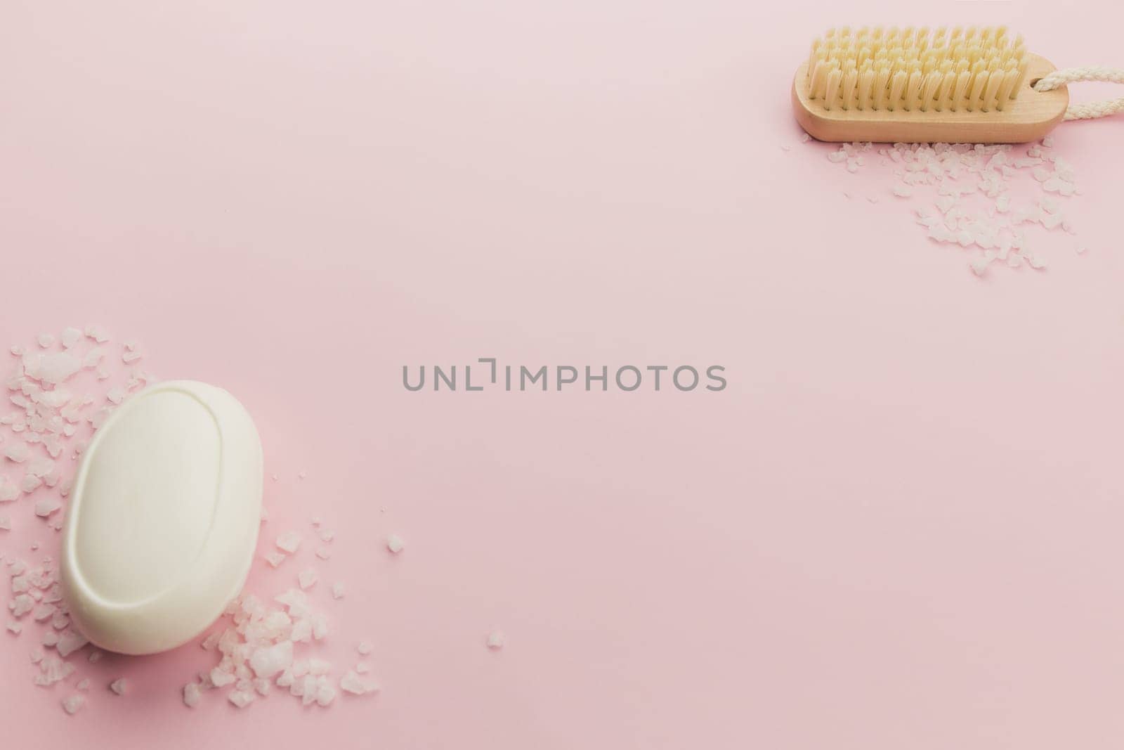 Soap and brush on the pink background. High quality photo